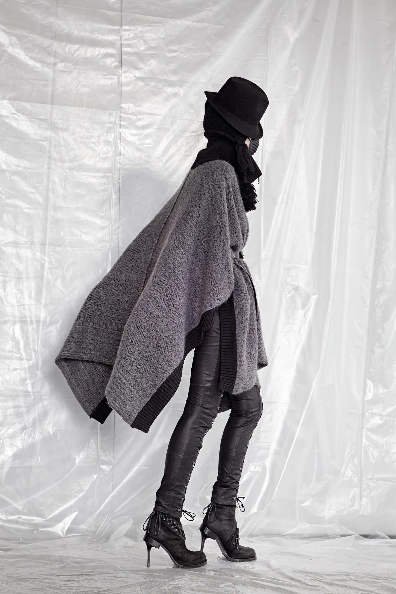 gray wool poncho with black leather pants