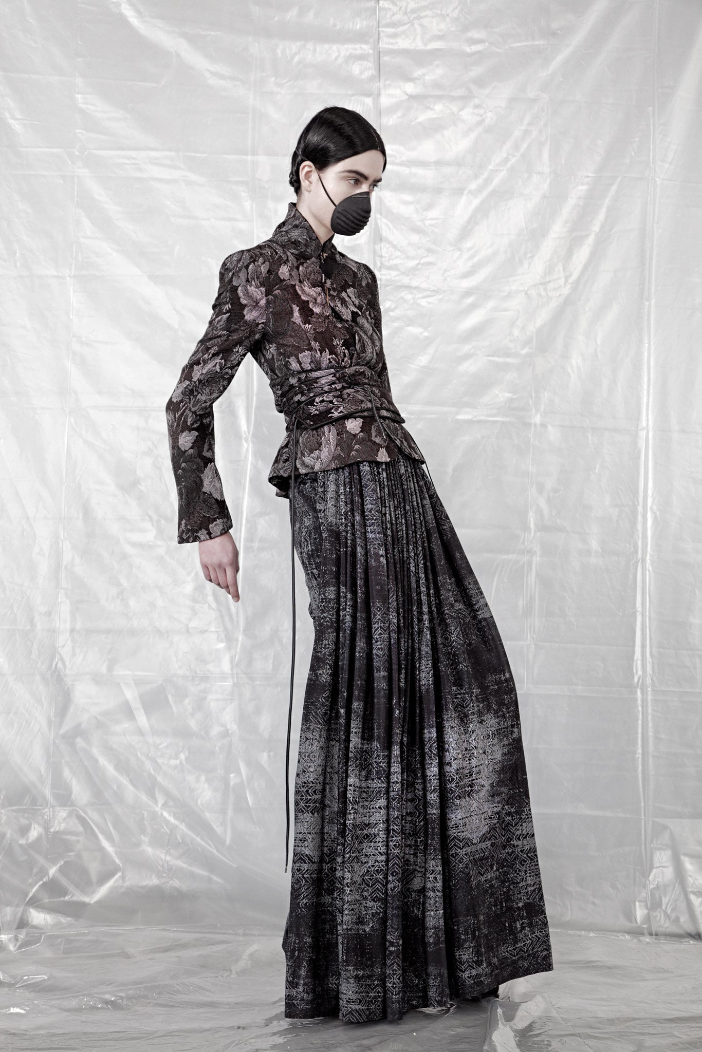 tailored black silk blazer and pleated skirt