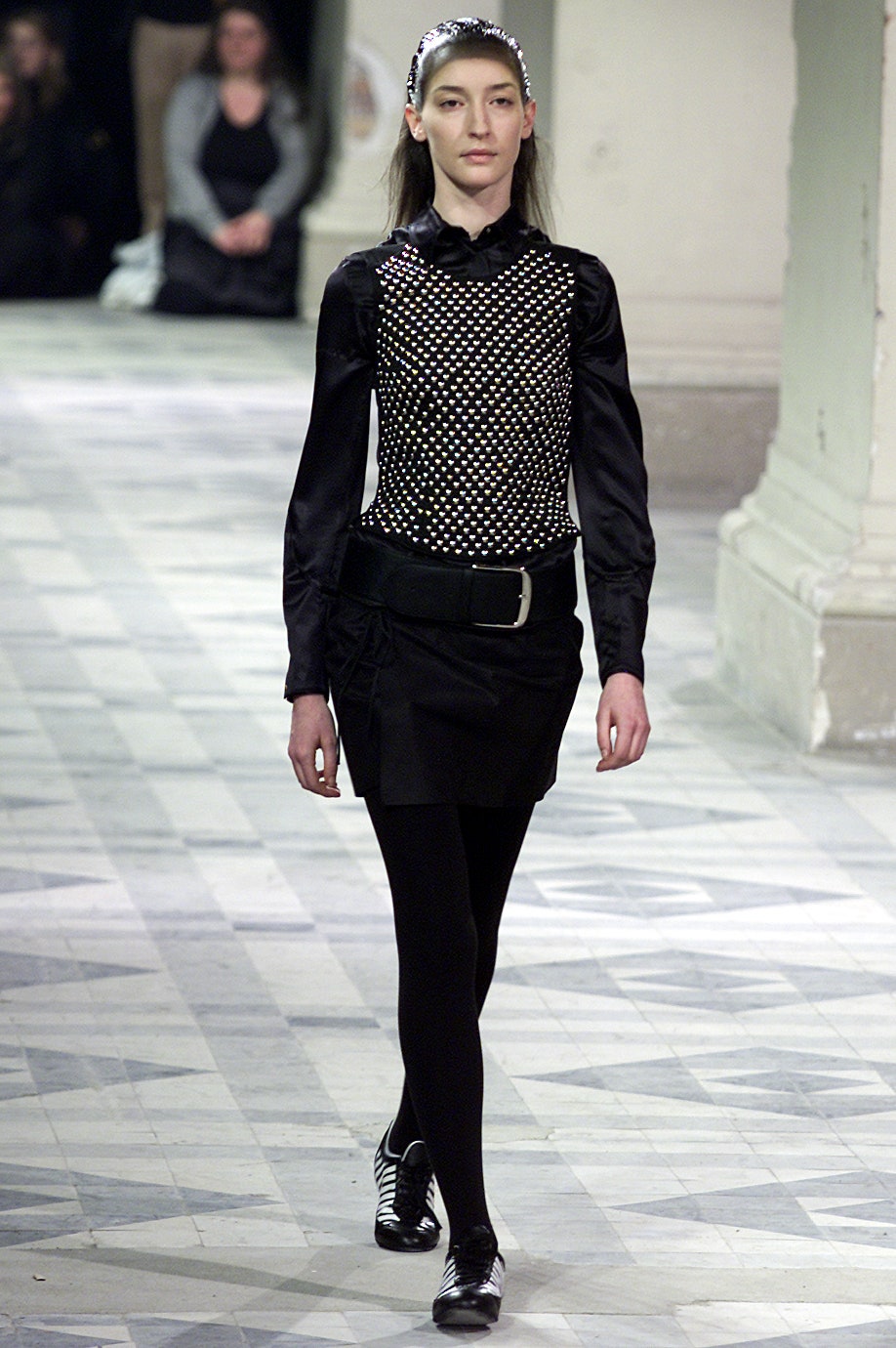 black fitted top and mini skirt