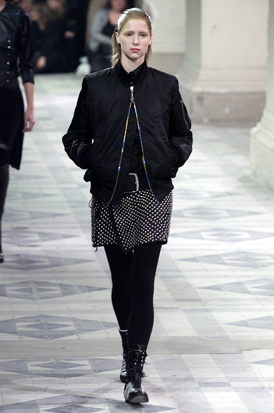 black fitted jacket and mini skirt