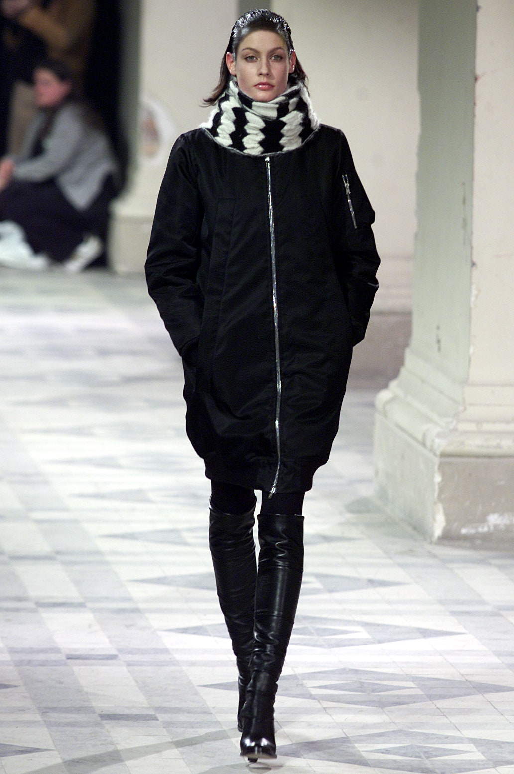 black relaxed coat with striped scarf