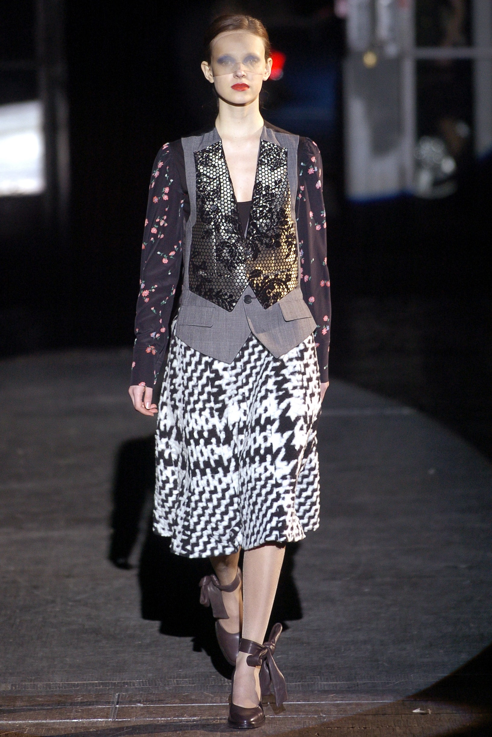 gray beaded vest with floral blouse