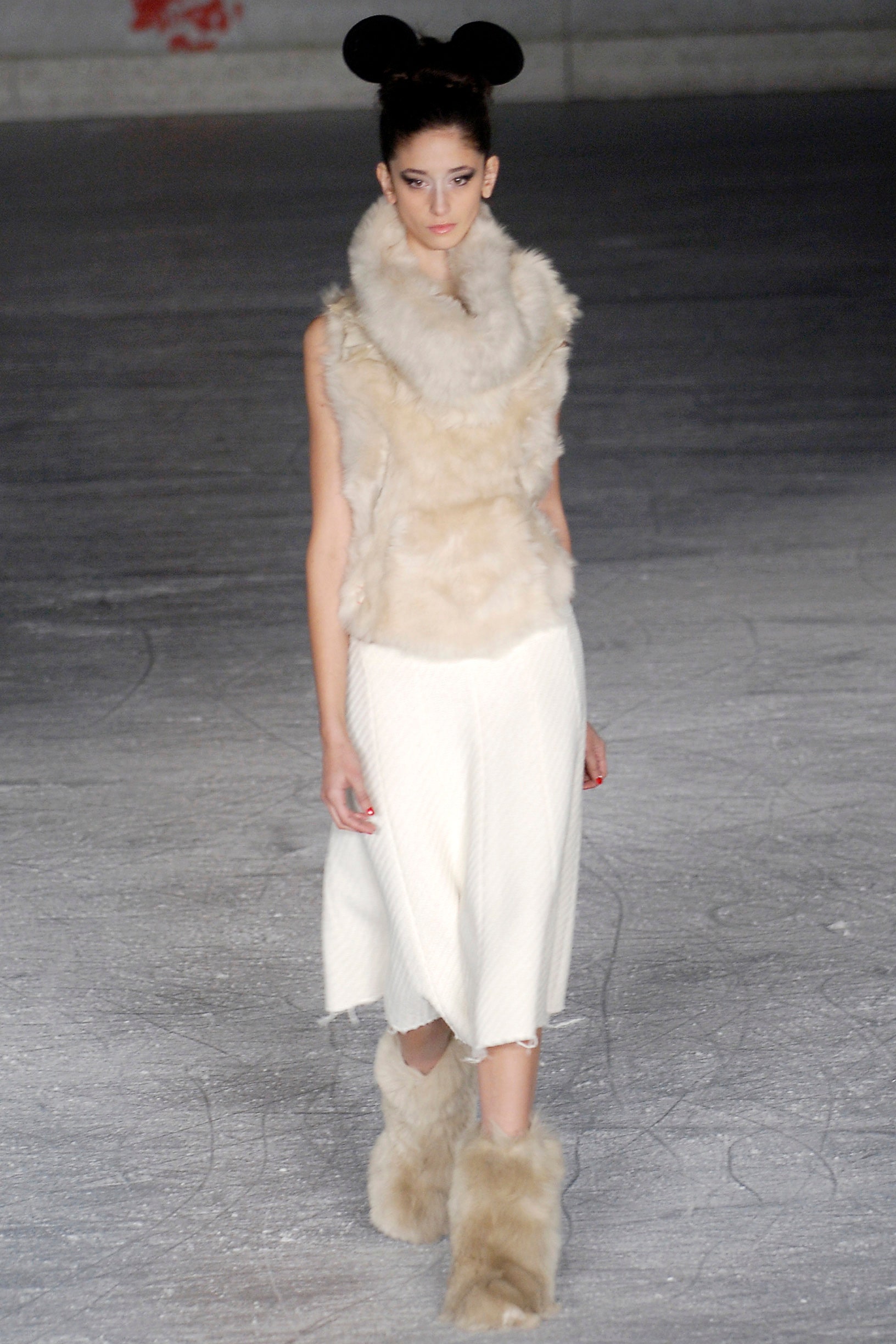 beige fur top white pleated skirt