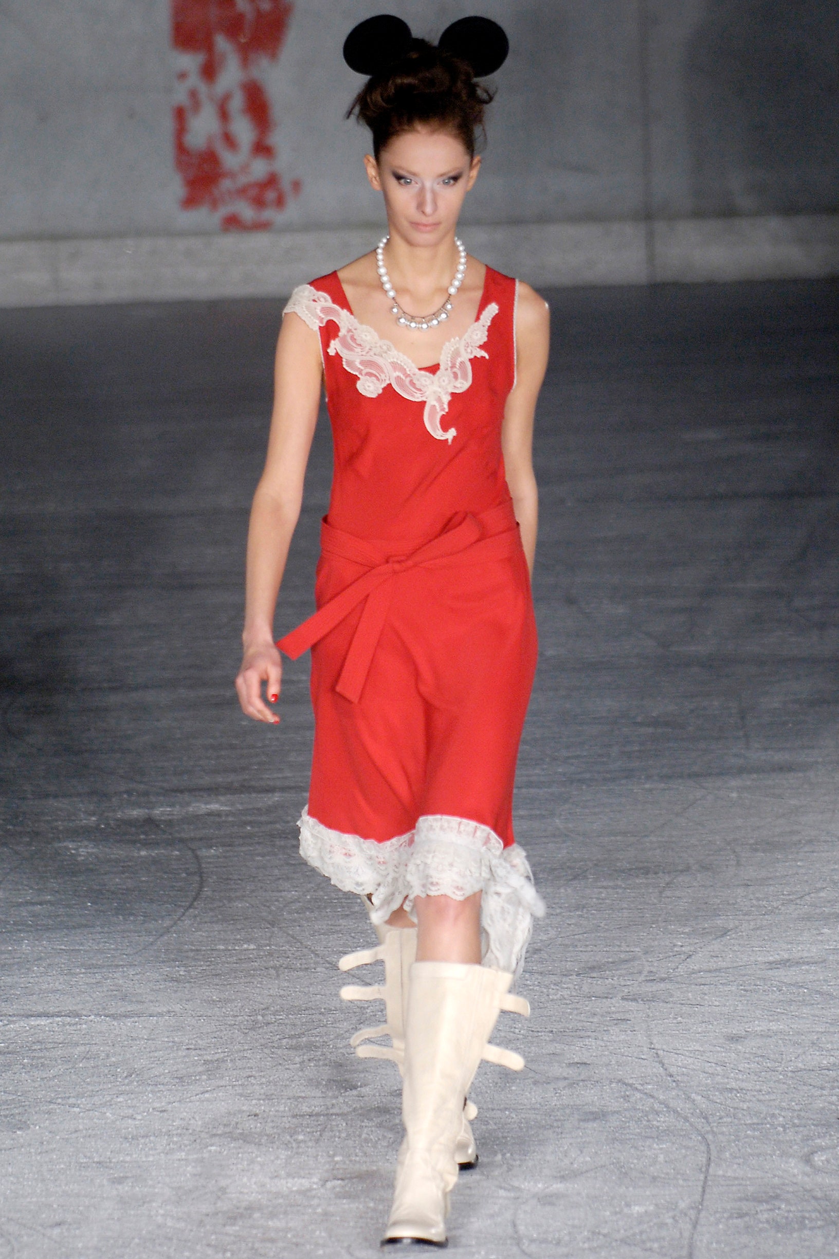 red silk sleeveless dress with white boots