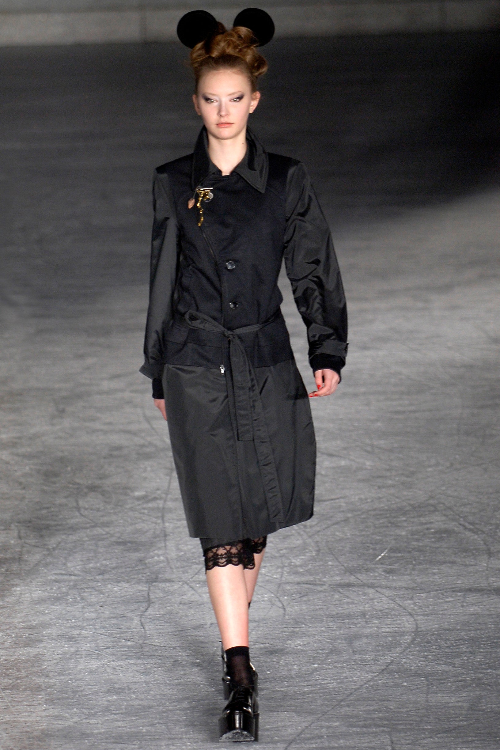 black fitted coat with lace skirt