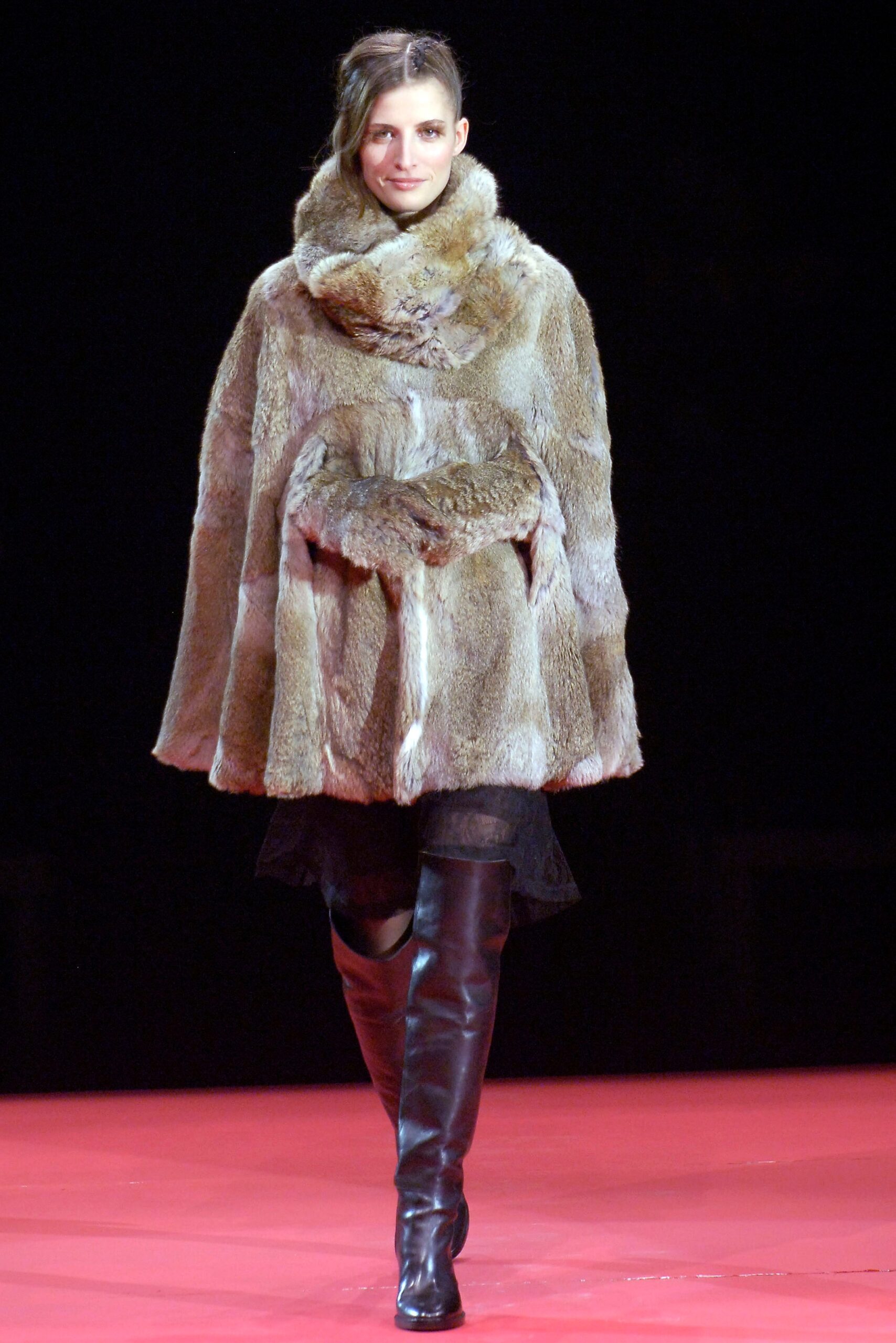 brown fur cape with black boots