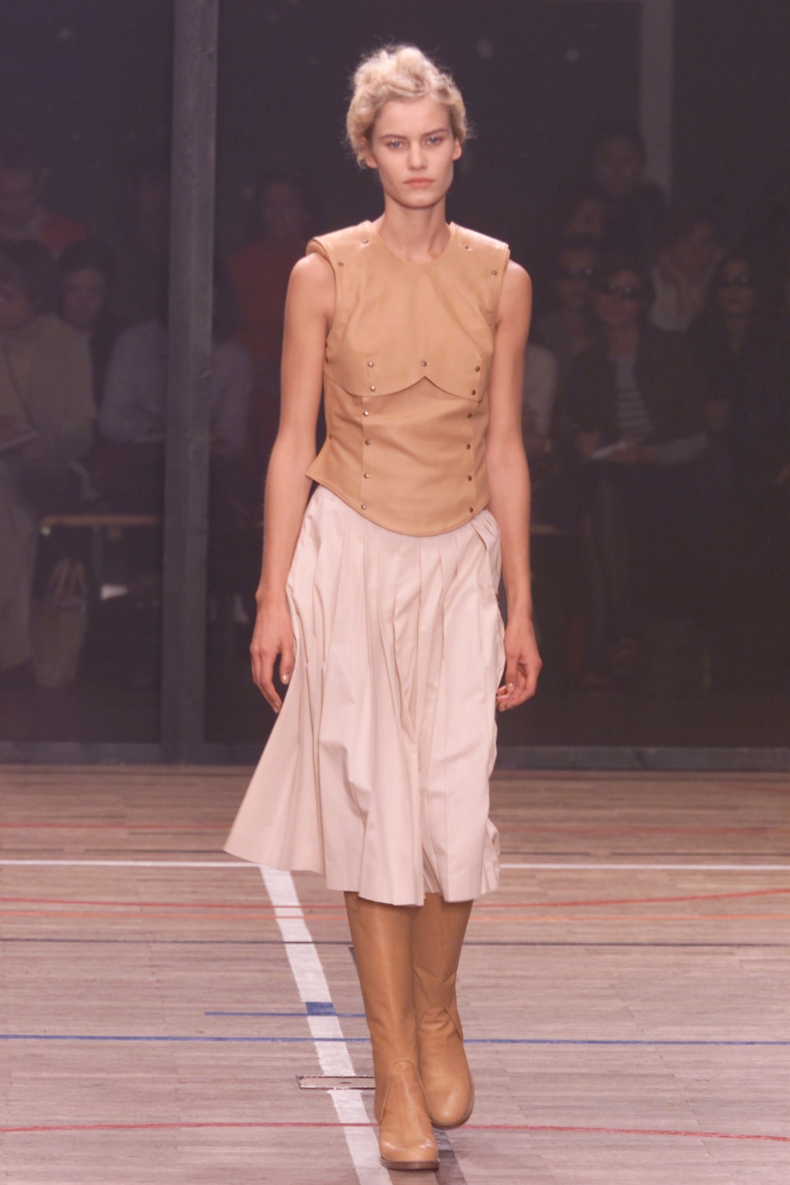 beige leather sleeveless collared fitted buttoned top