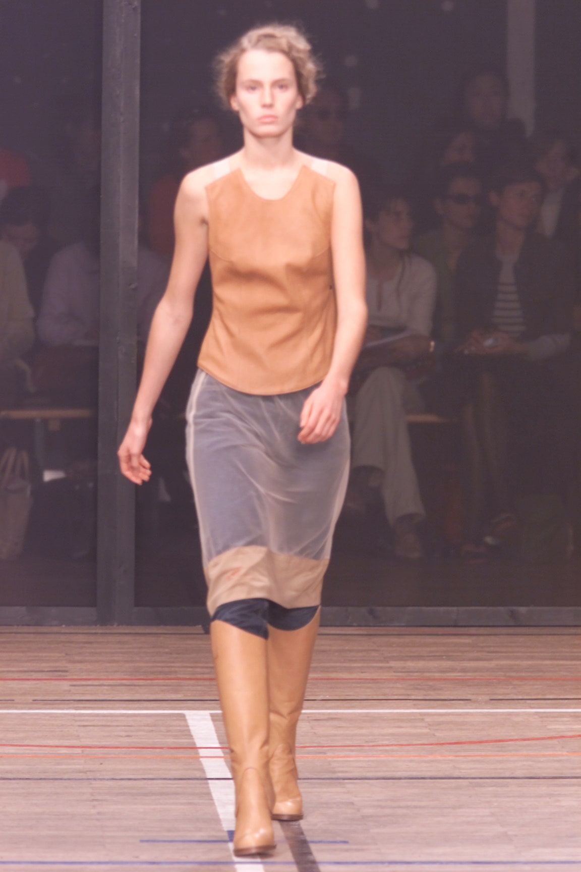 brown leather sleeveless top with gray skirt