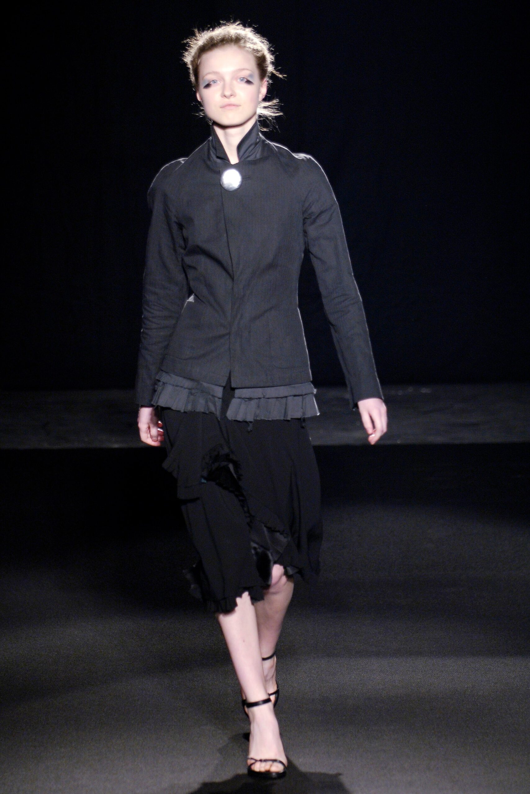 black fitted jacket and skirt