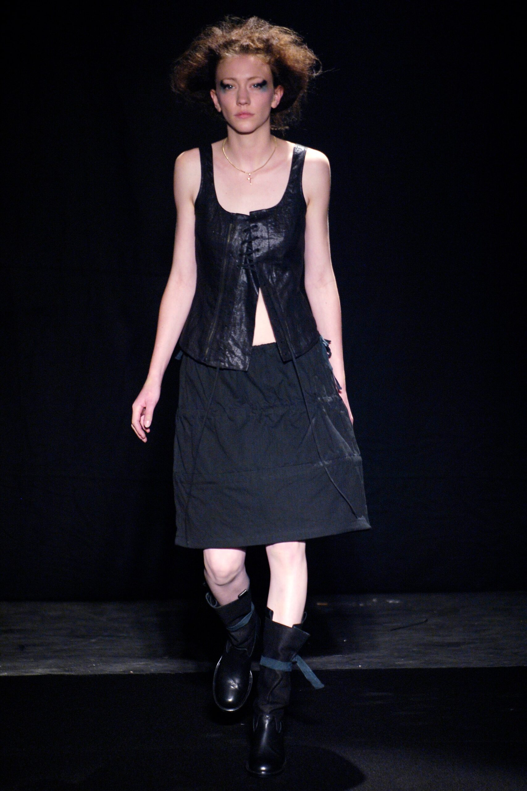 black leather sleeveless top and midi skirt