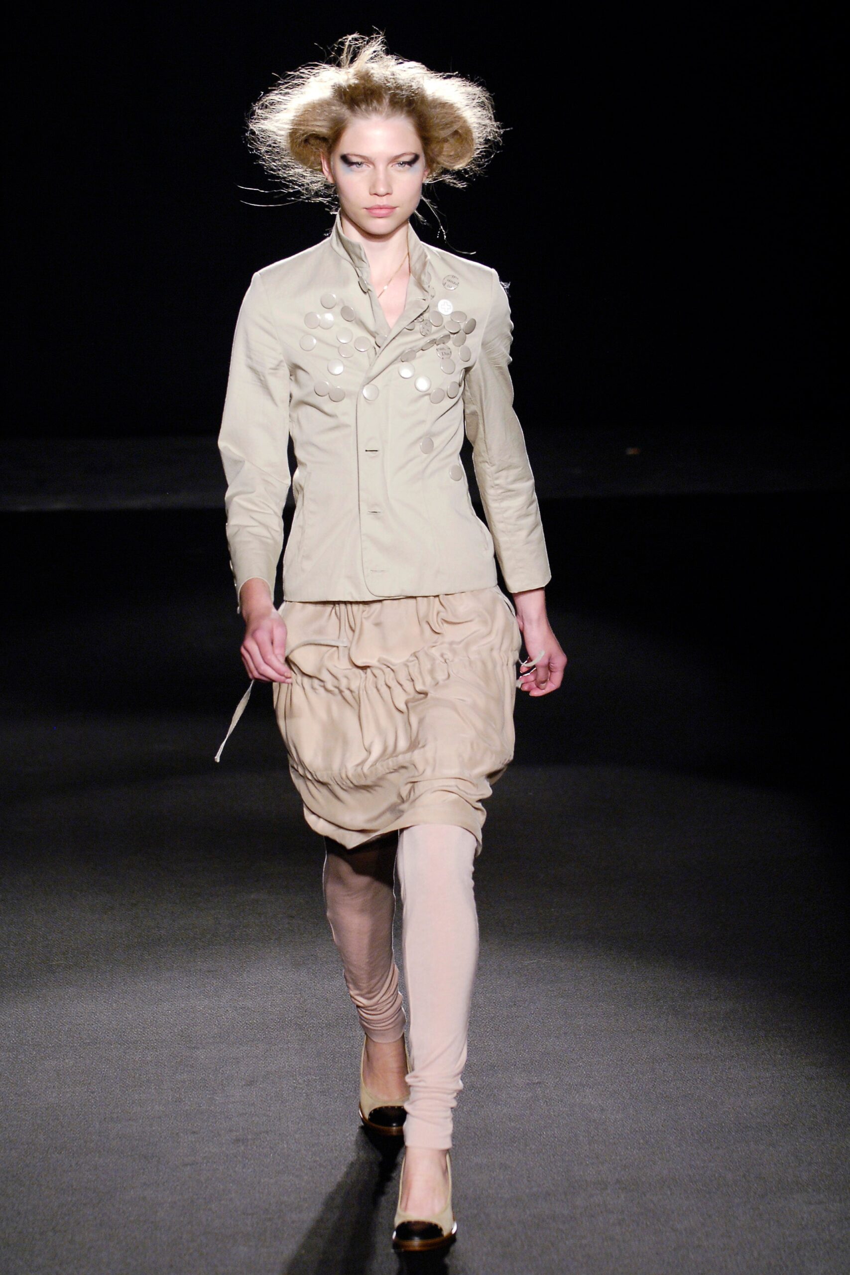 beige fitted jacket with ruched skirt