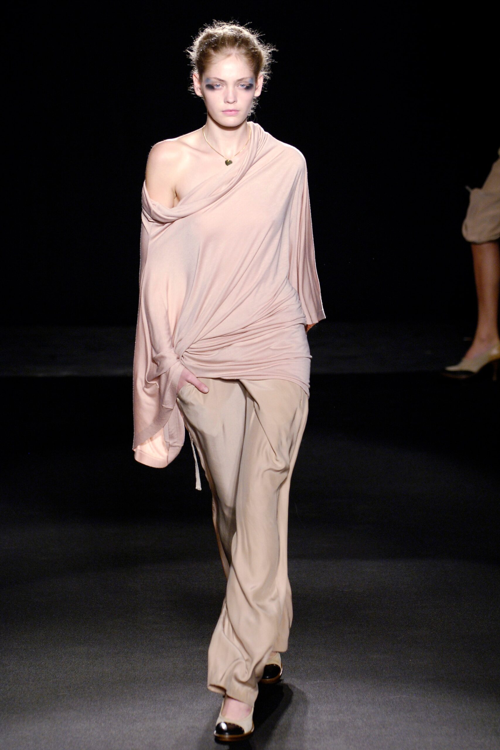 pink off-shoulder top with beige pants