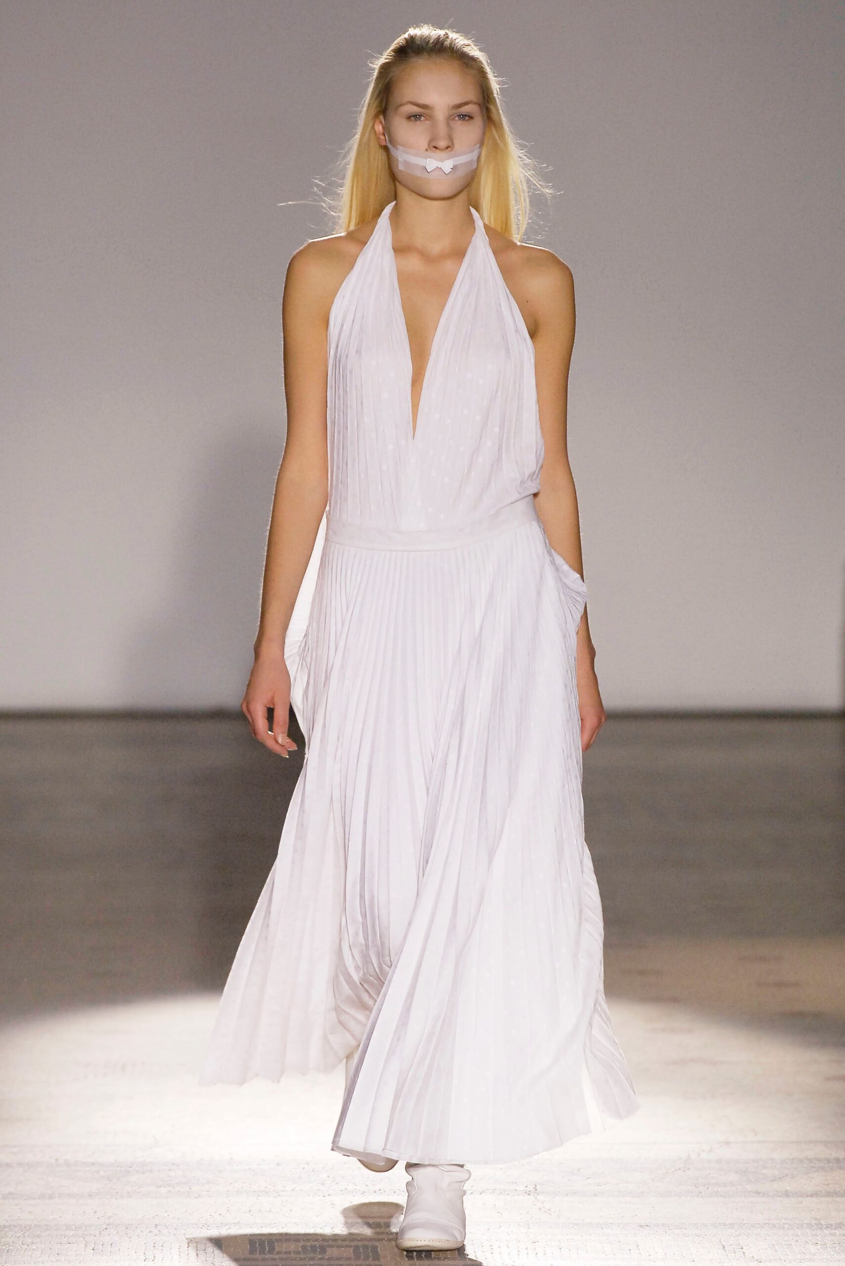 white pleated sleeveless dress