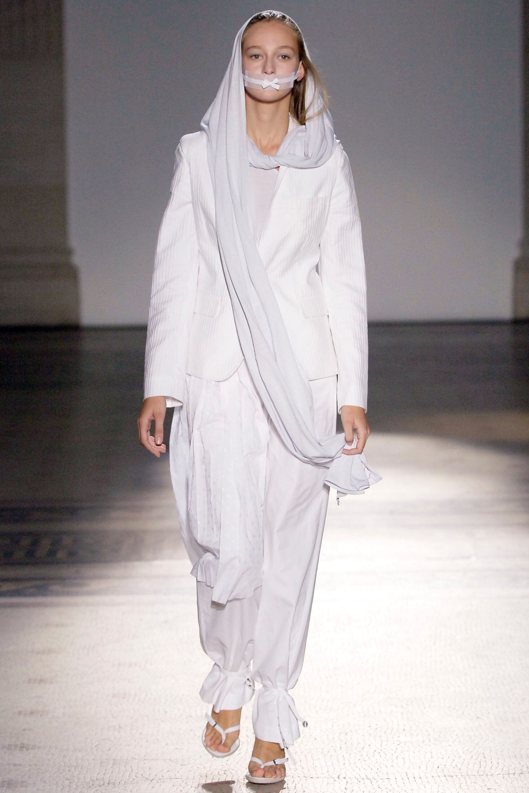 white tailored suit with scarf