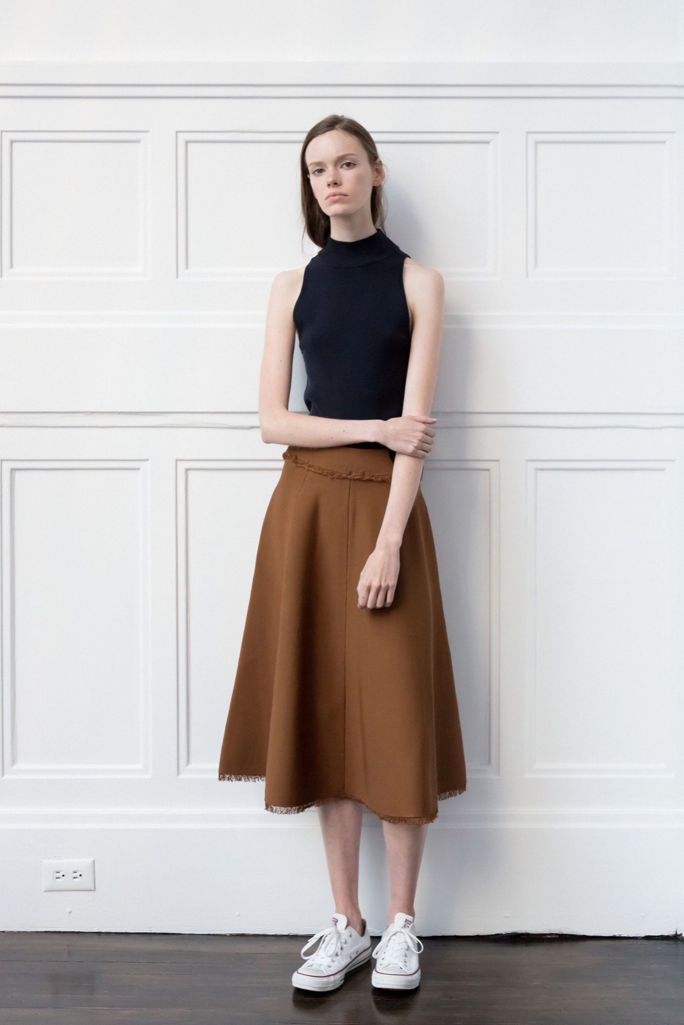 black sleeveless high-neck fitted top