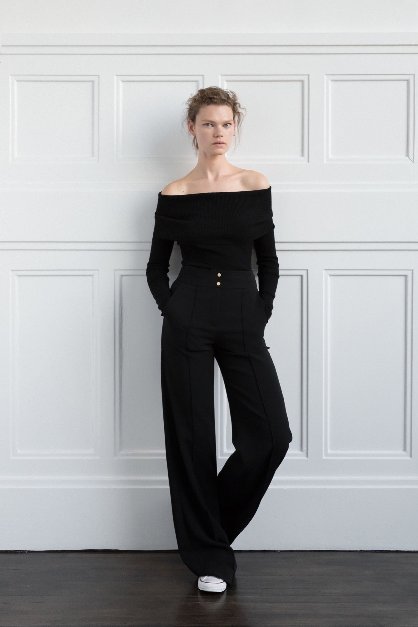 black off-shoulder top and tailored pants