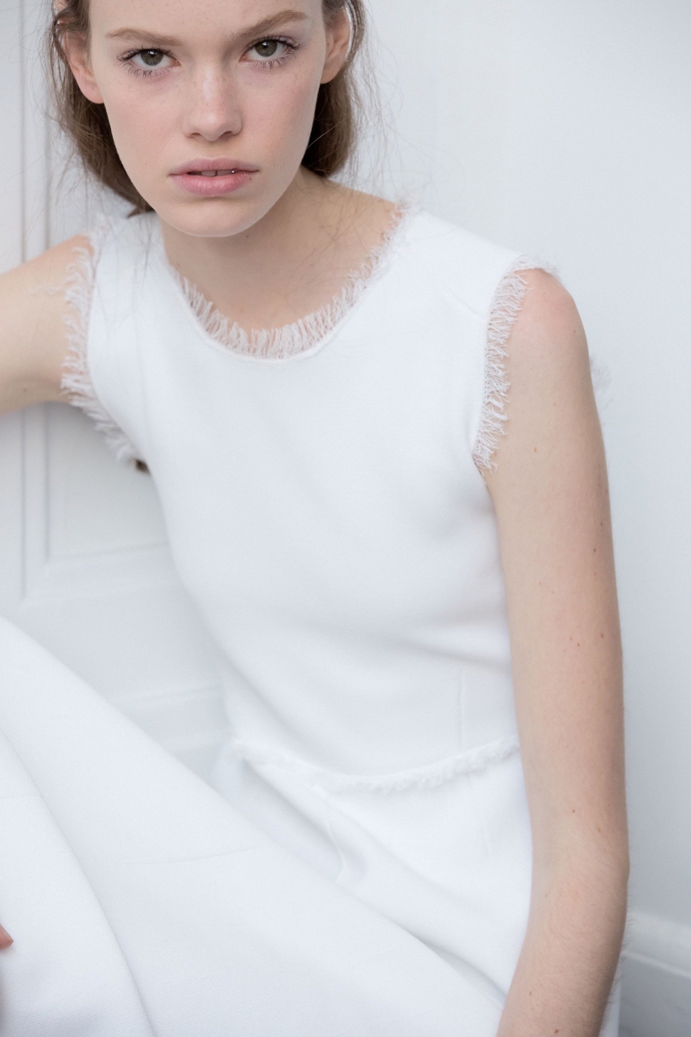 fitted white sleeveless dress