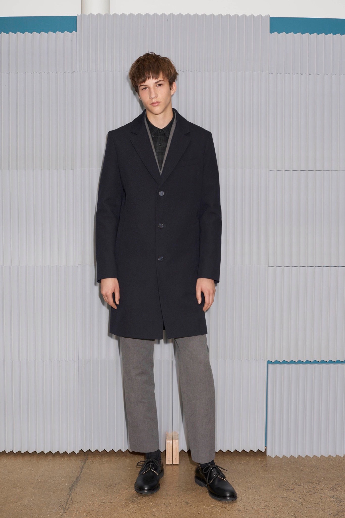 black tailored coat with gray pants