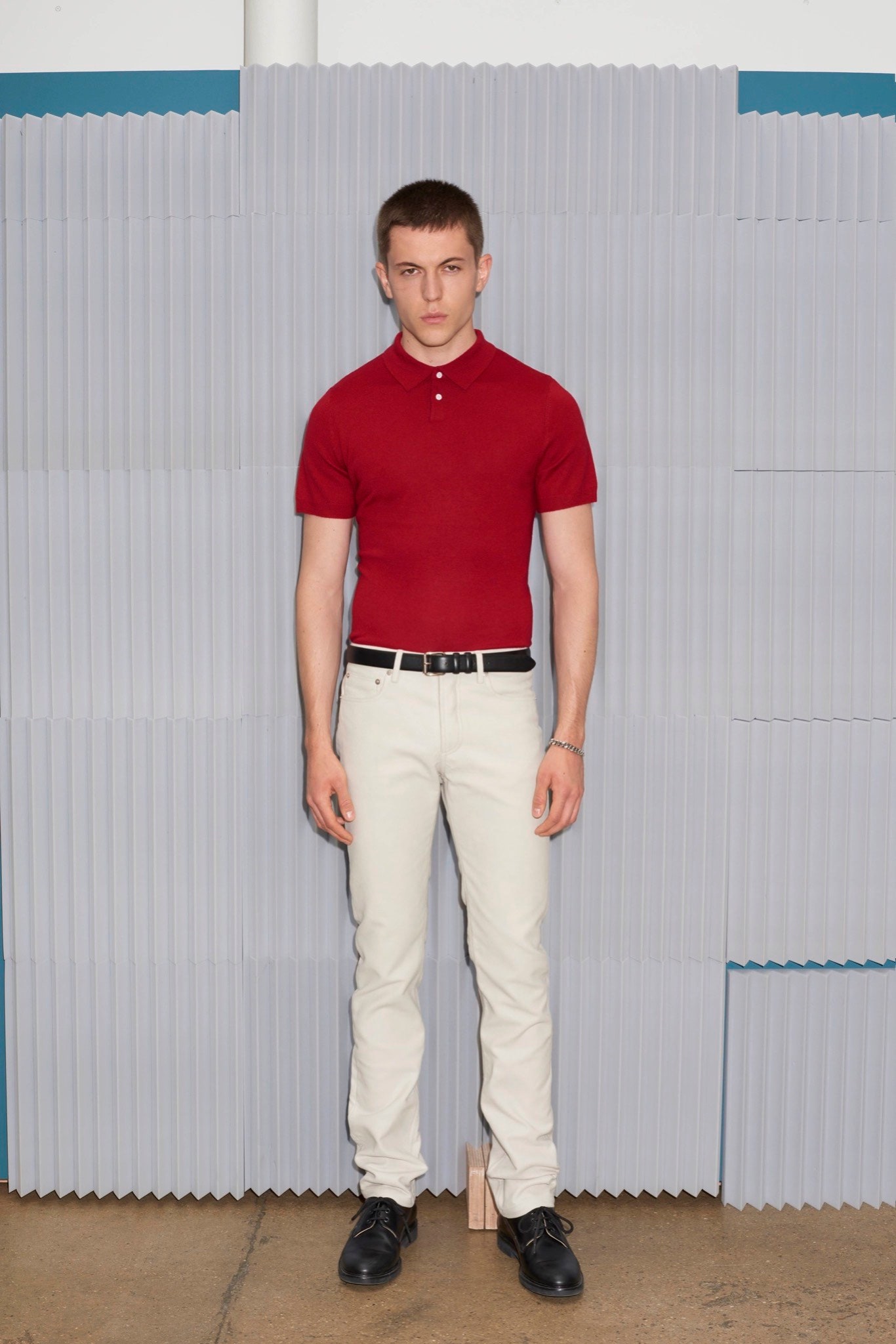 red fitted shirt with white pants