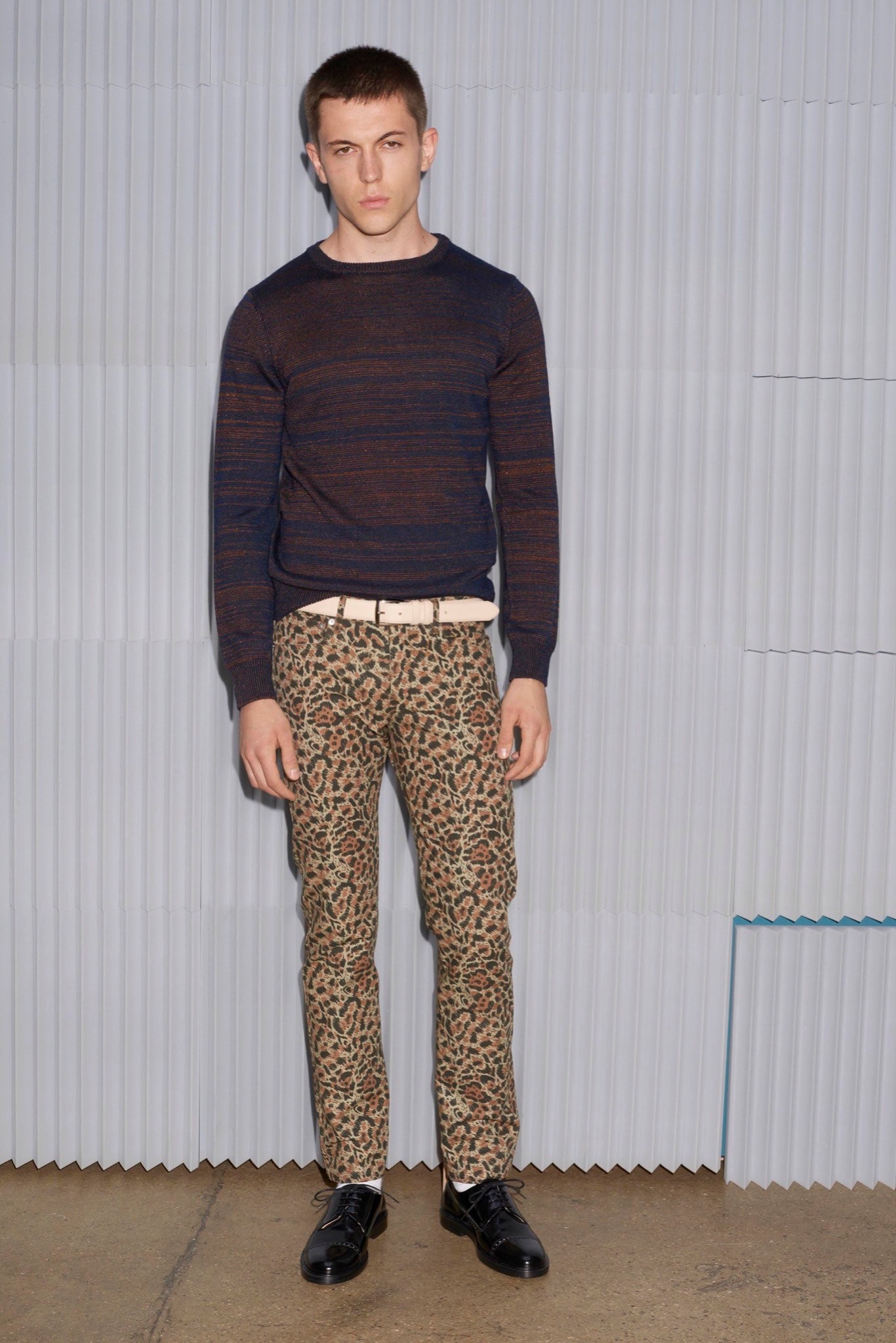 striped blue brown sweater and animal-print pants