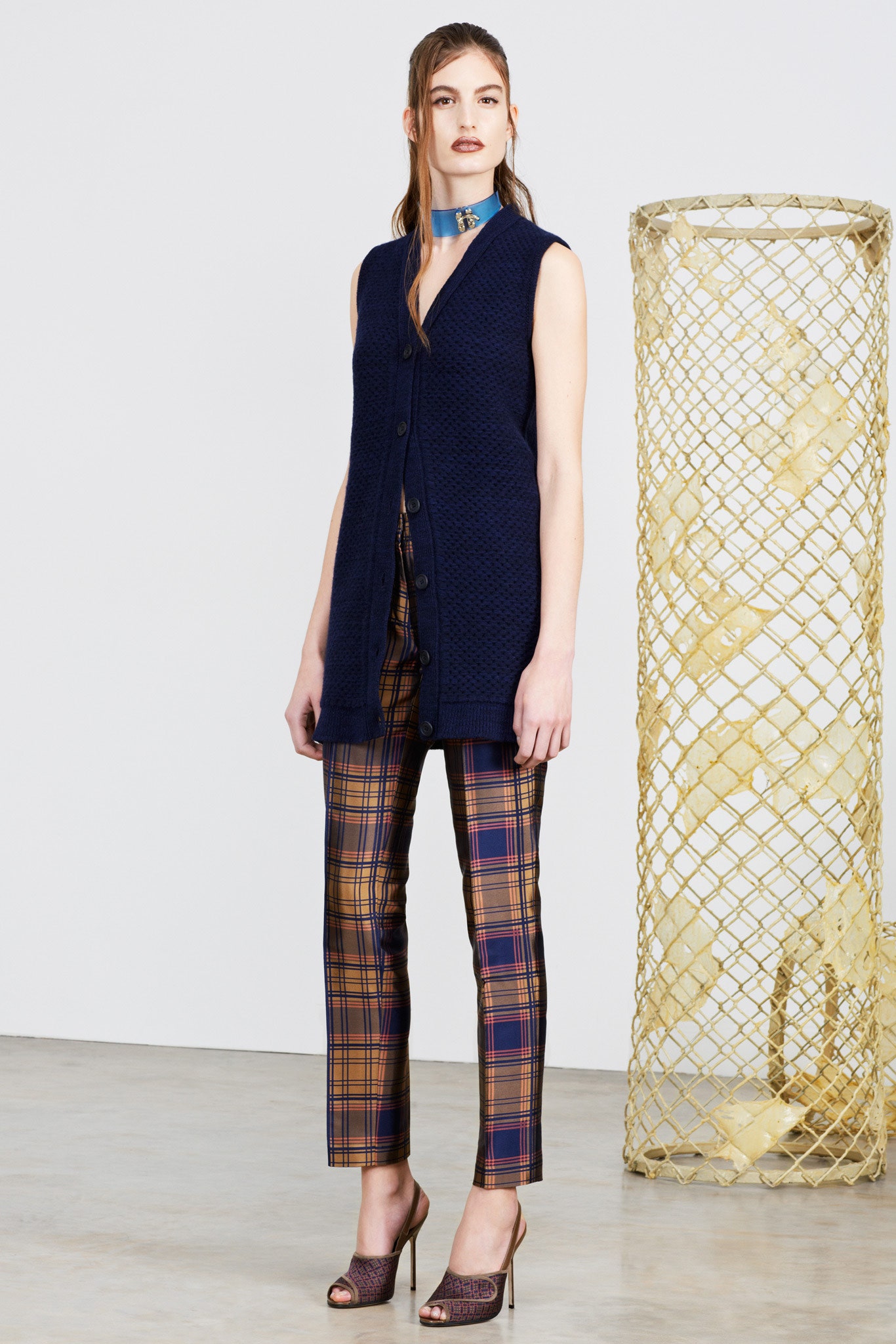 navy vest with checked pants