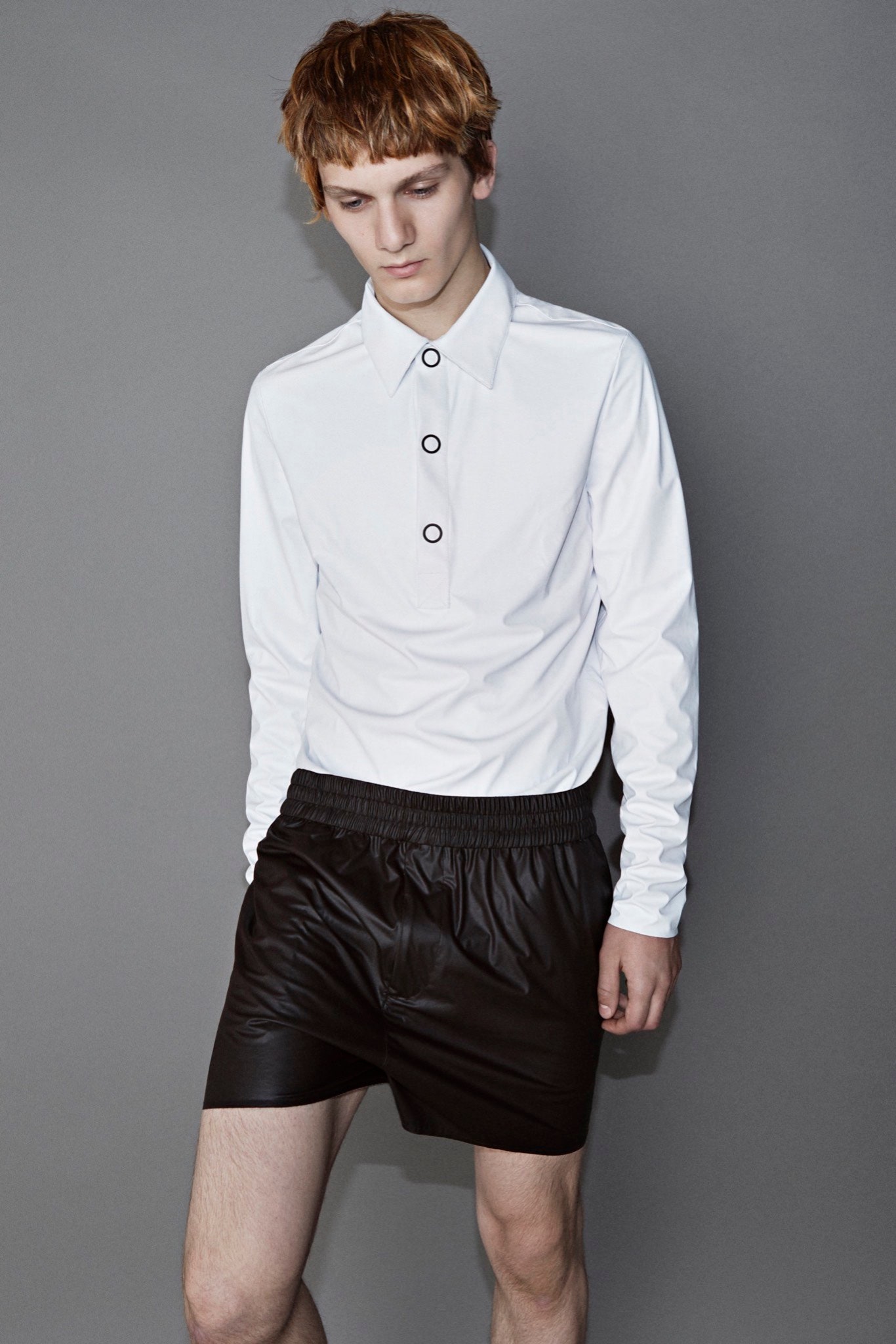 white fitted shirt and black leather shorts