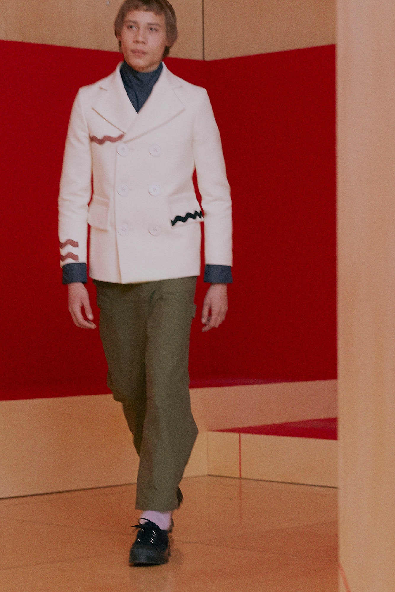 white tailored jacket and green pants