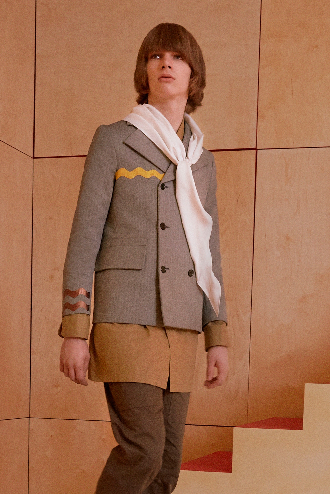 gray tailored blazer with beige shirt