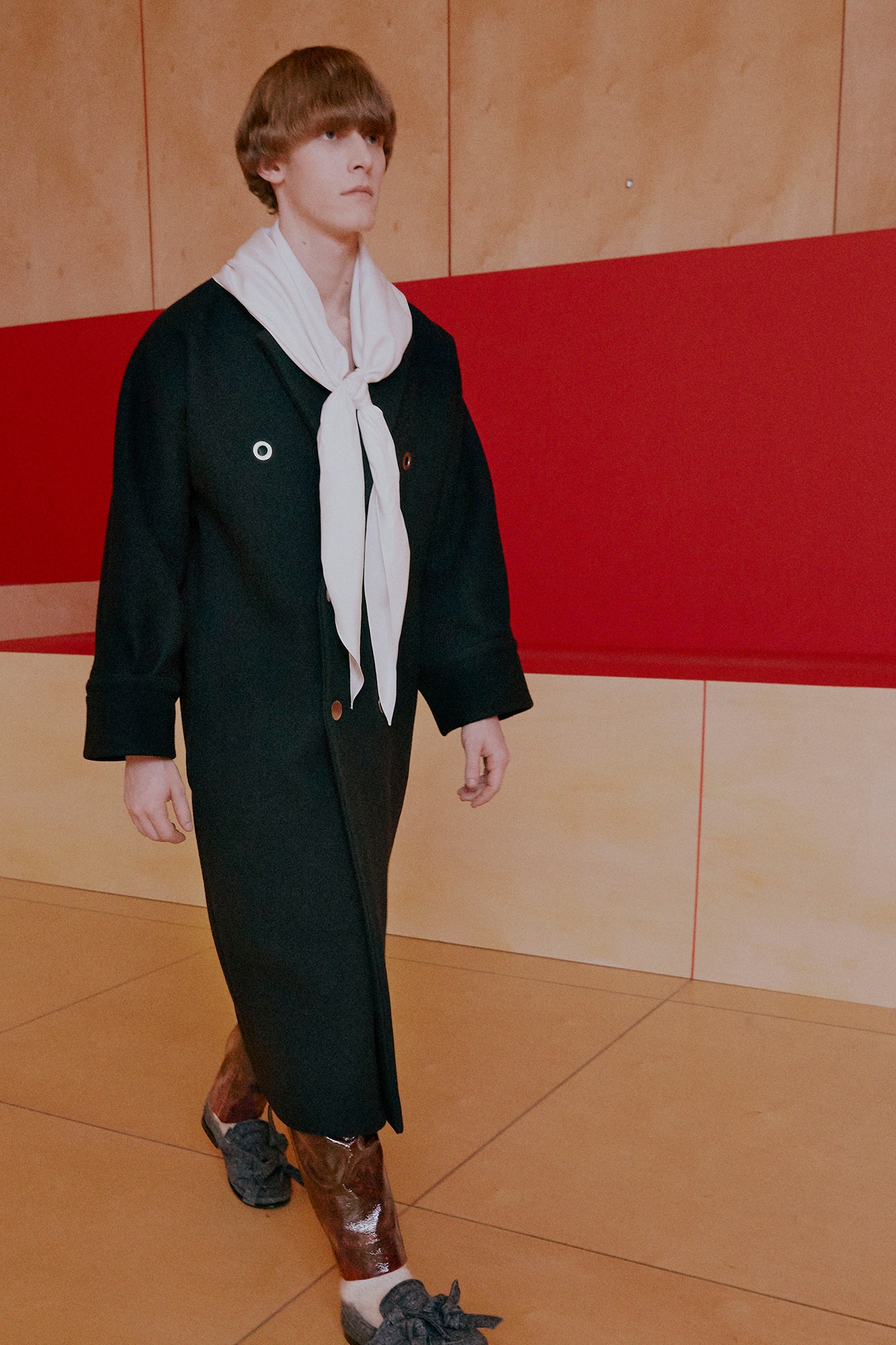 black wool coat with white scarf