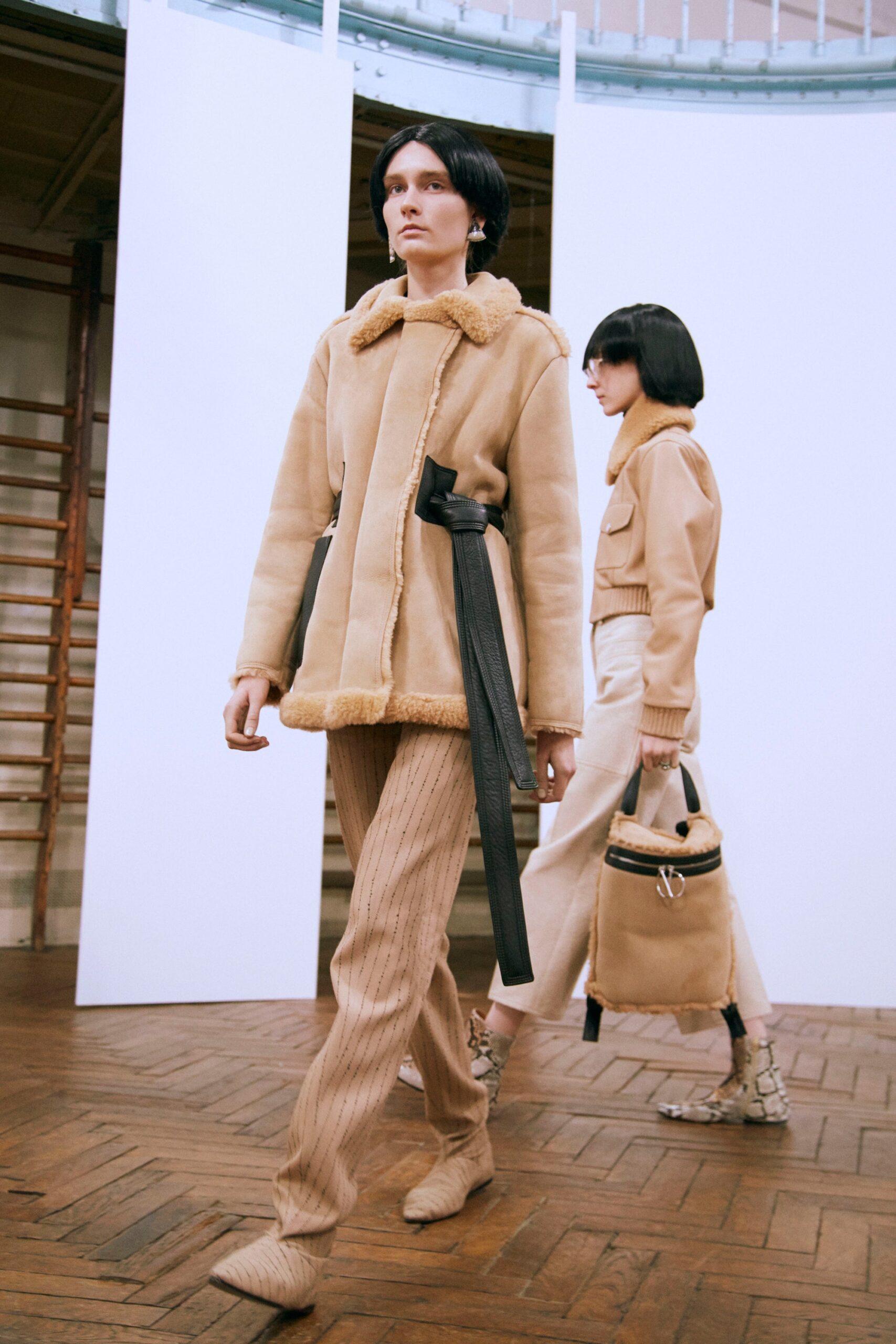 beige faux-fur coat and fitted pants