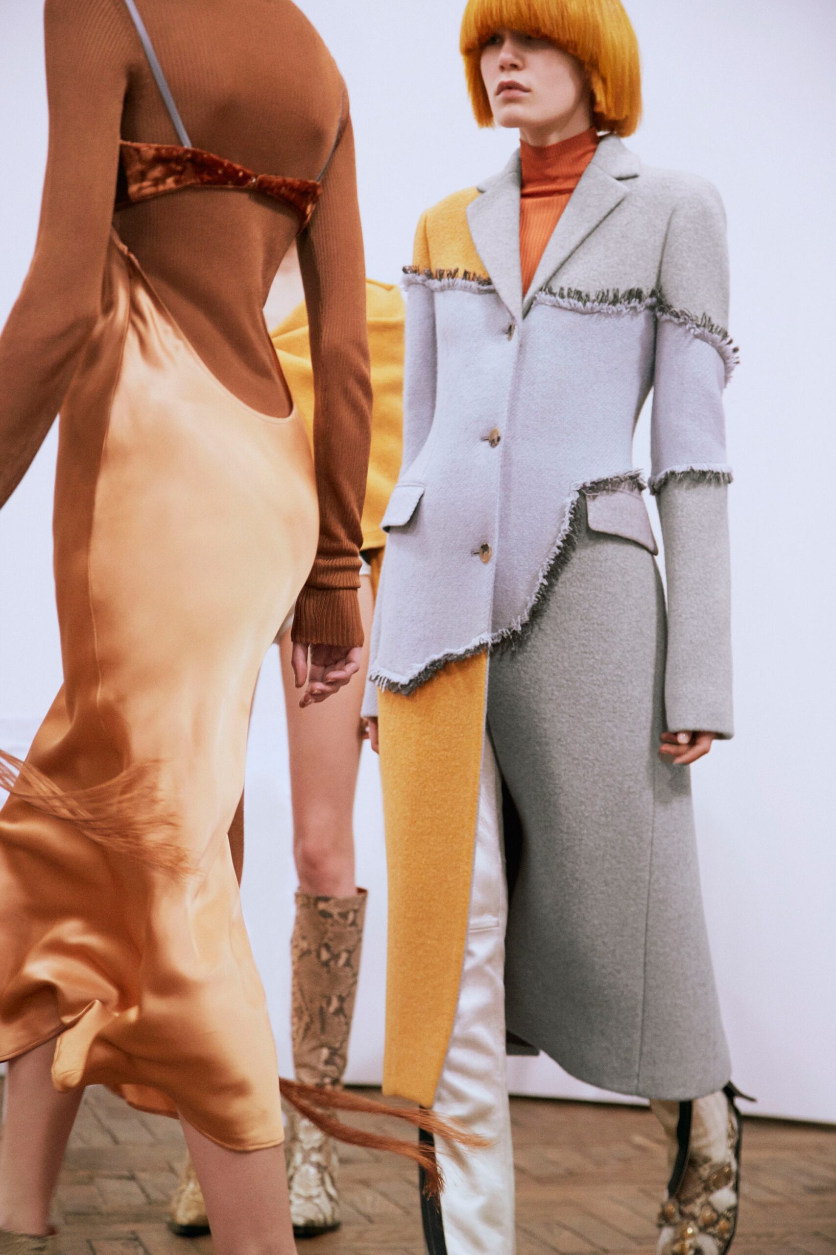 tailored gray coat and orange dress