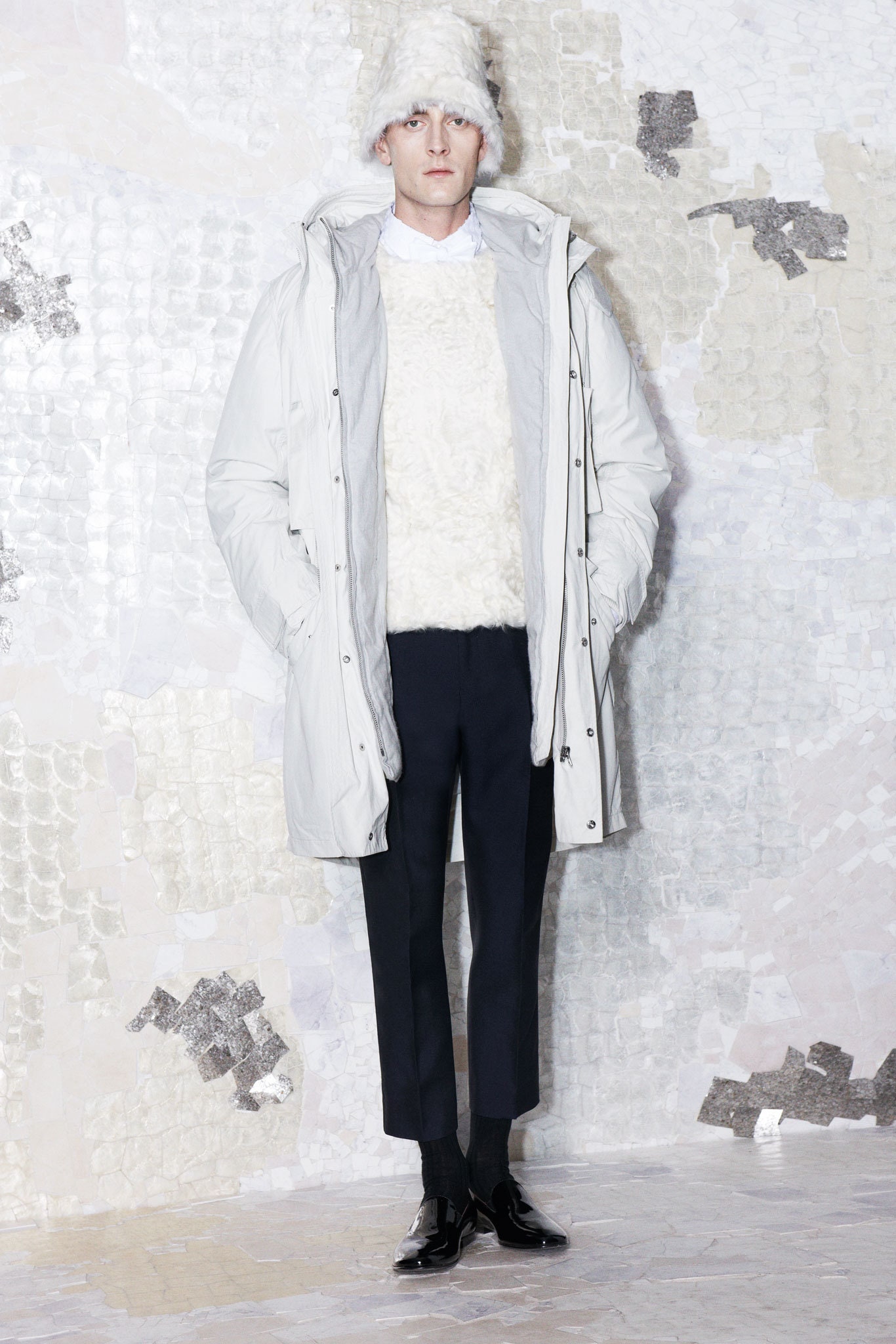 white faux-fur parka and sweater