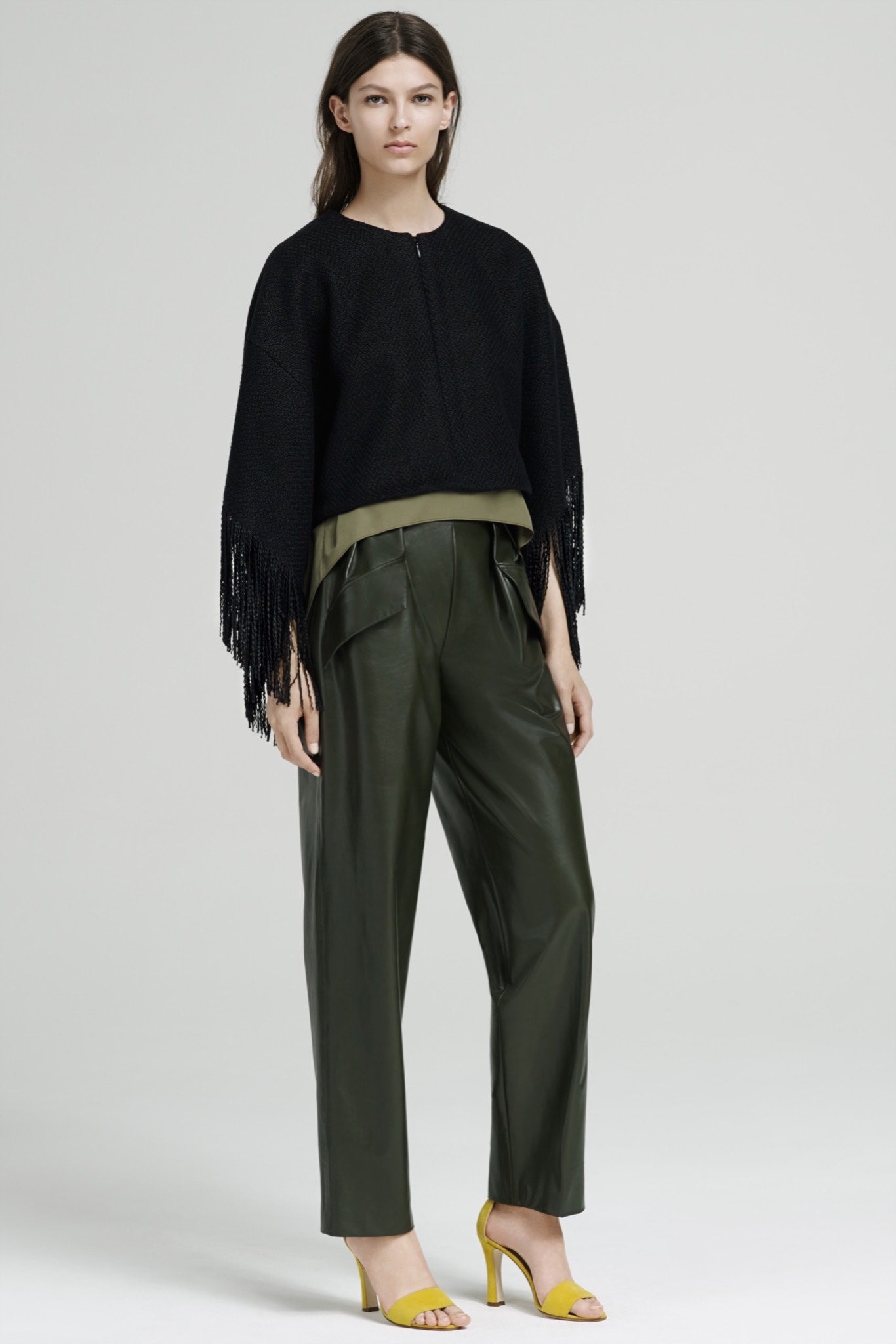 black relaxed top green leather pants