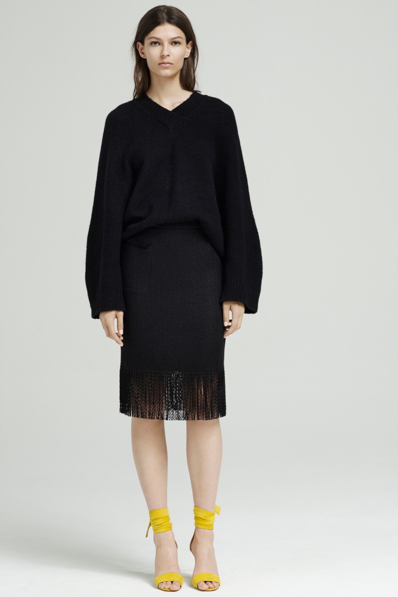 black oversized sweater with fringed skirt