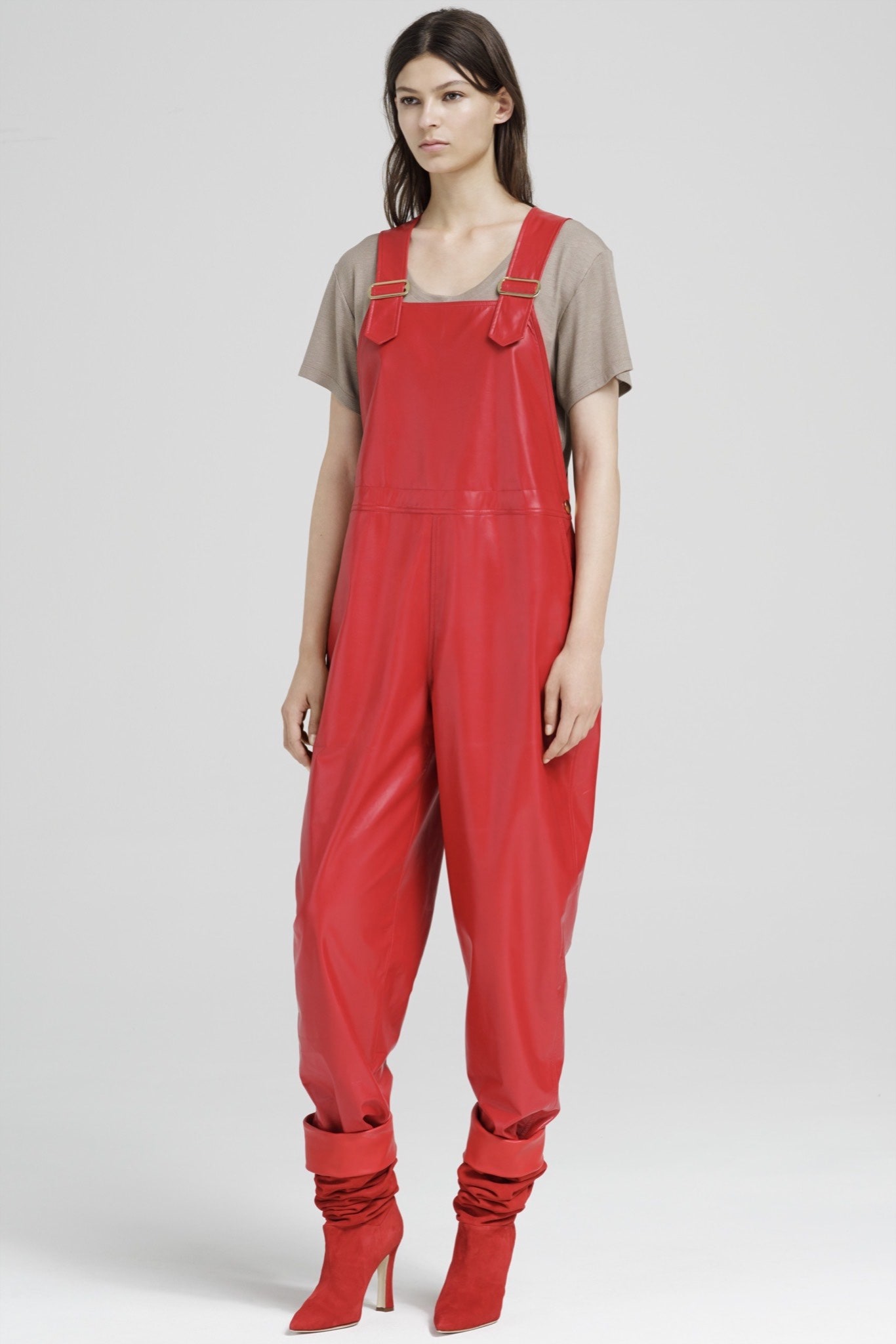 red vinyl jumpsuit with beige top