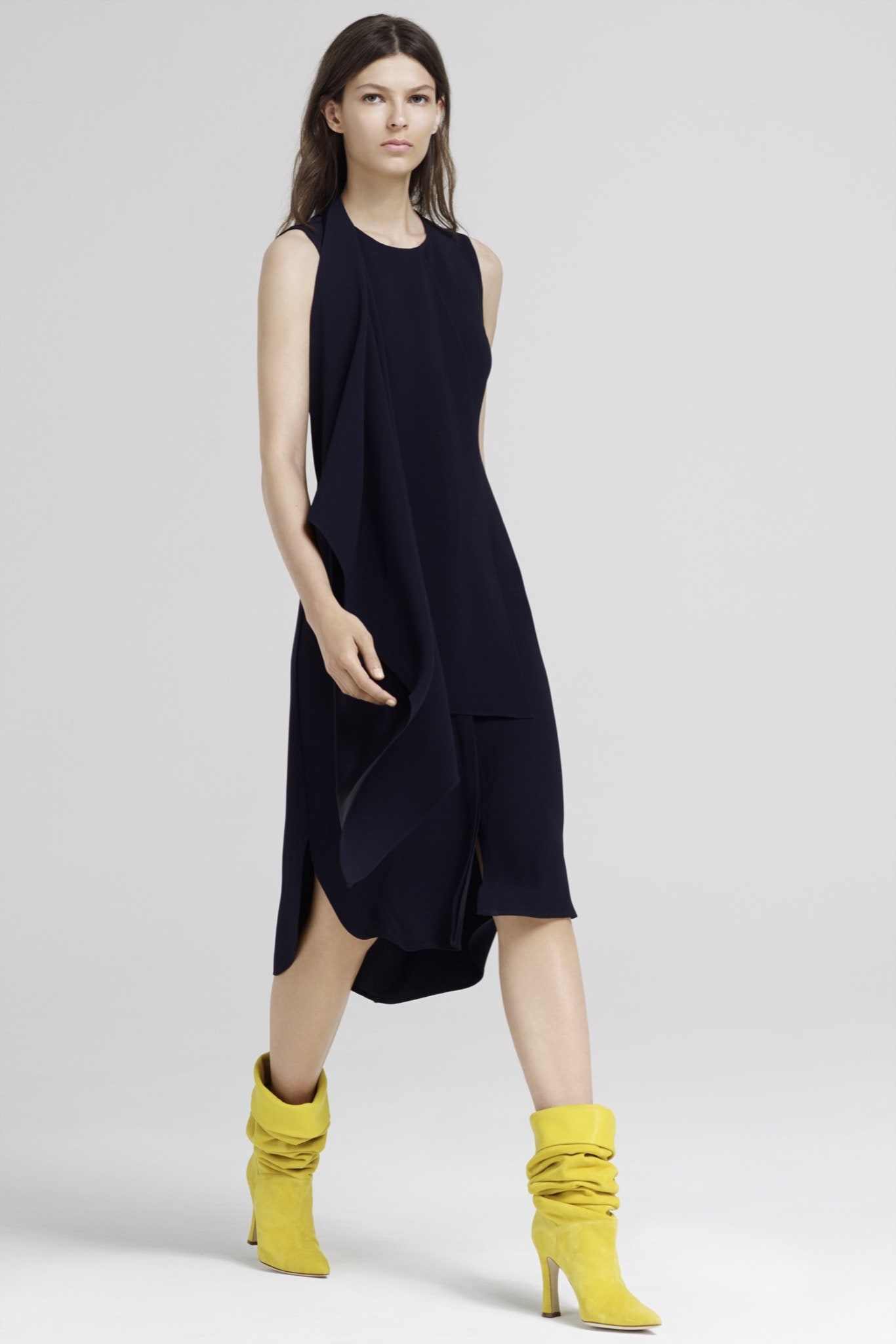 black draped midi dress with yellow boots