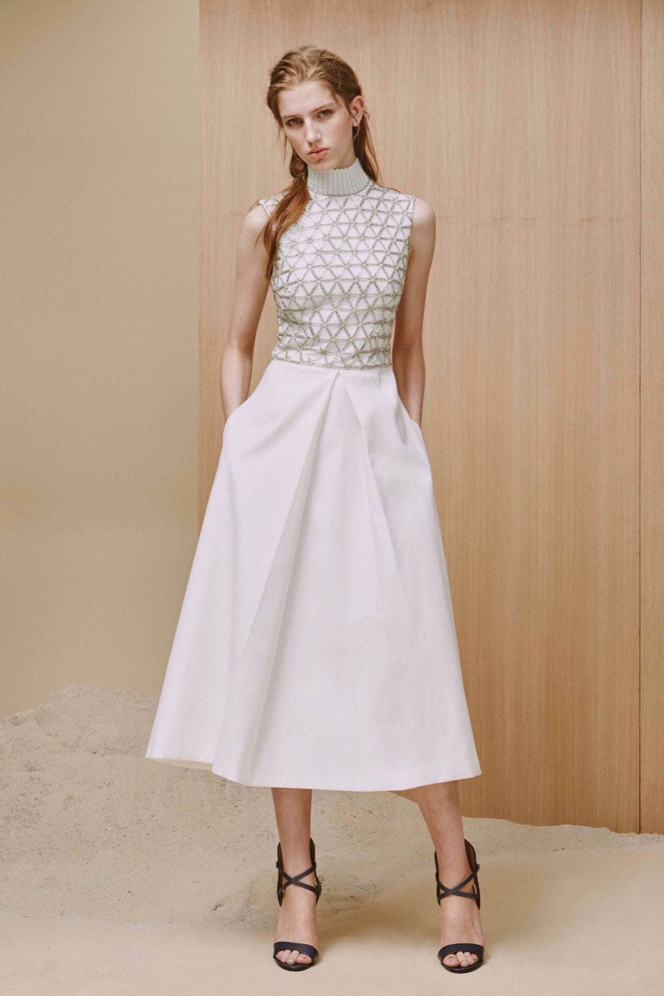 white cotton sleeveless high-neck fitted pleated top