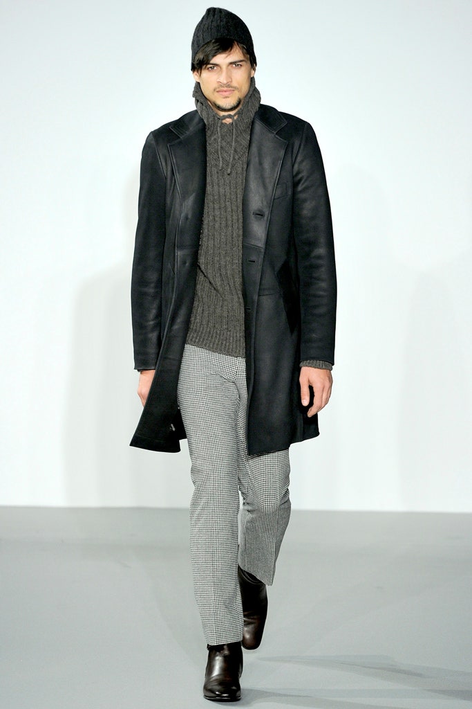 black leather coat with gray sweater
