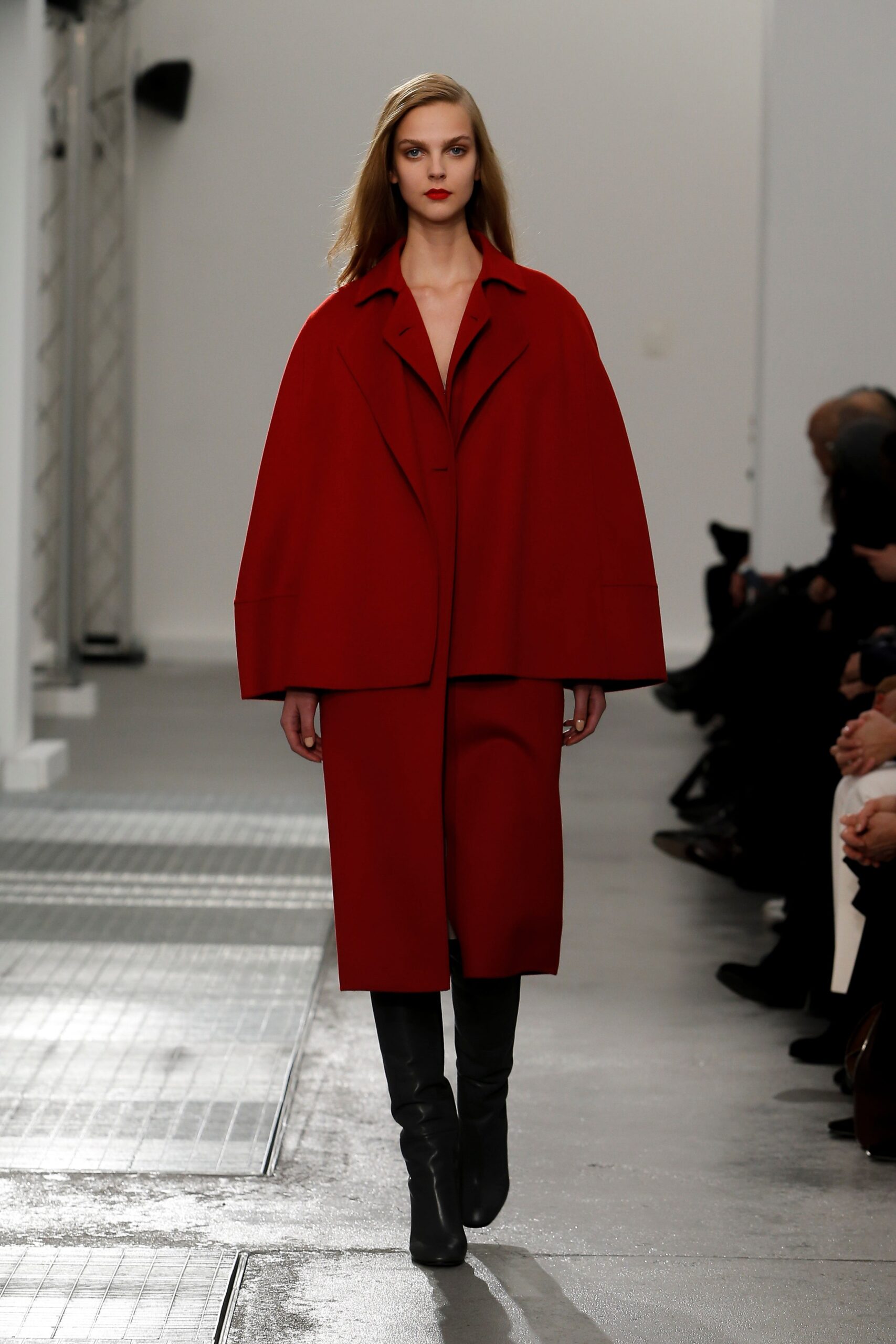 red relaxed coat with black pants