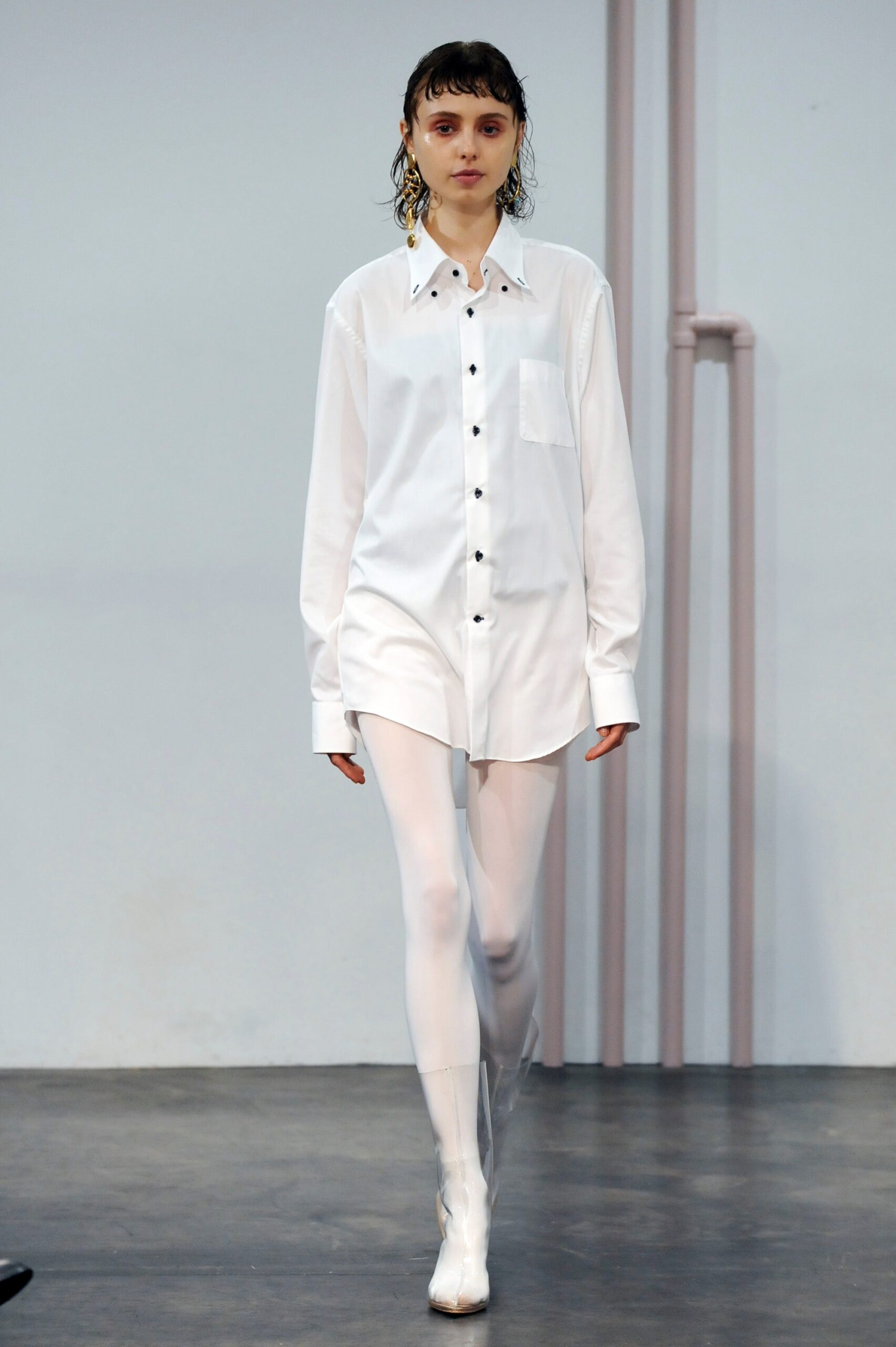 white relaxed shirt with shiny leggings