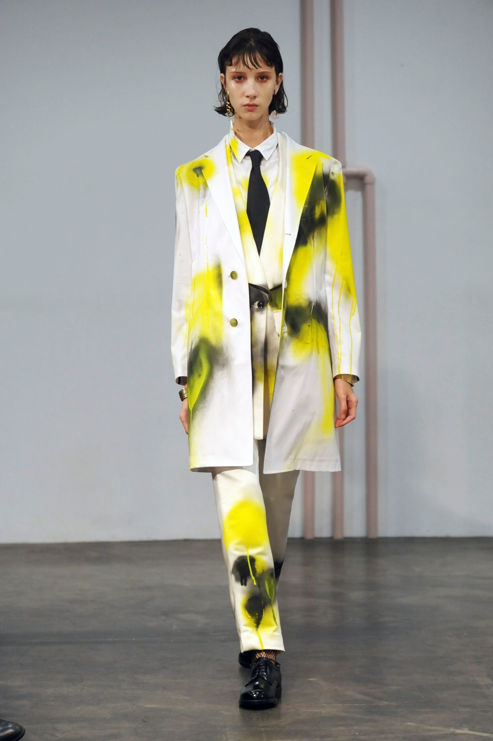 tailored white suit with yellow accents