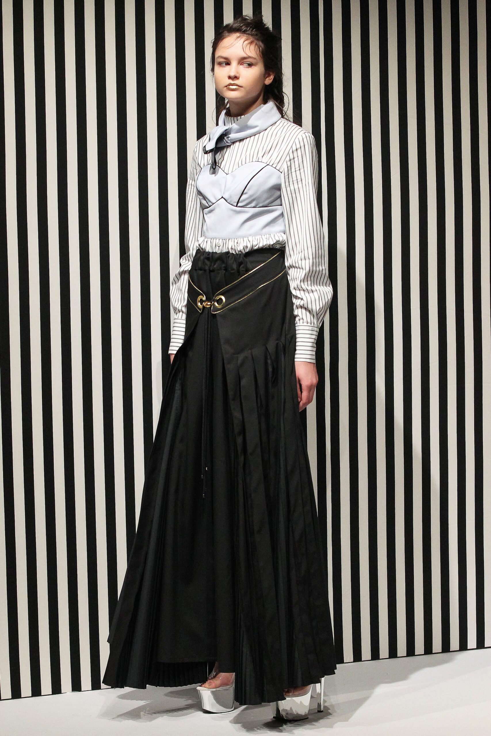 blue and white striped blouse with black pleated skirt