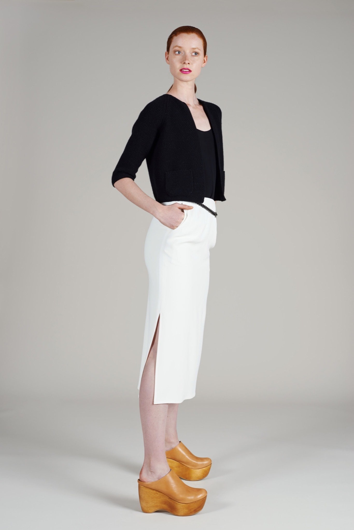 black fitted jacket with white midi skirt