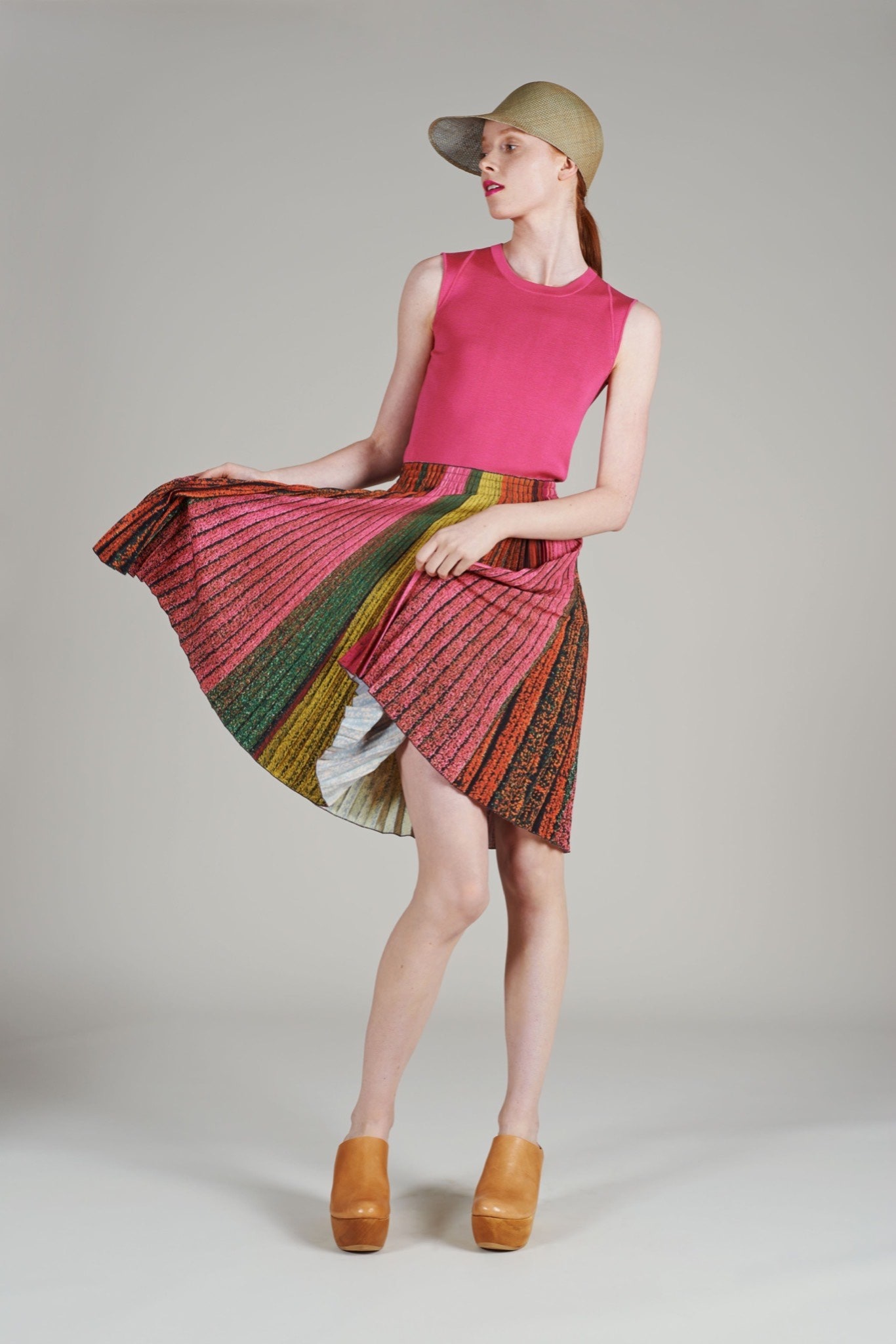 pink fitted top with multi pleated skirt