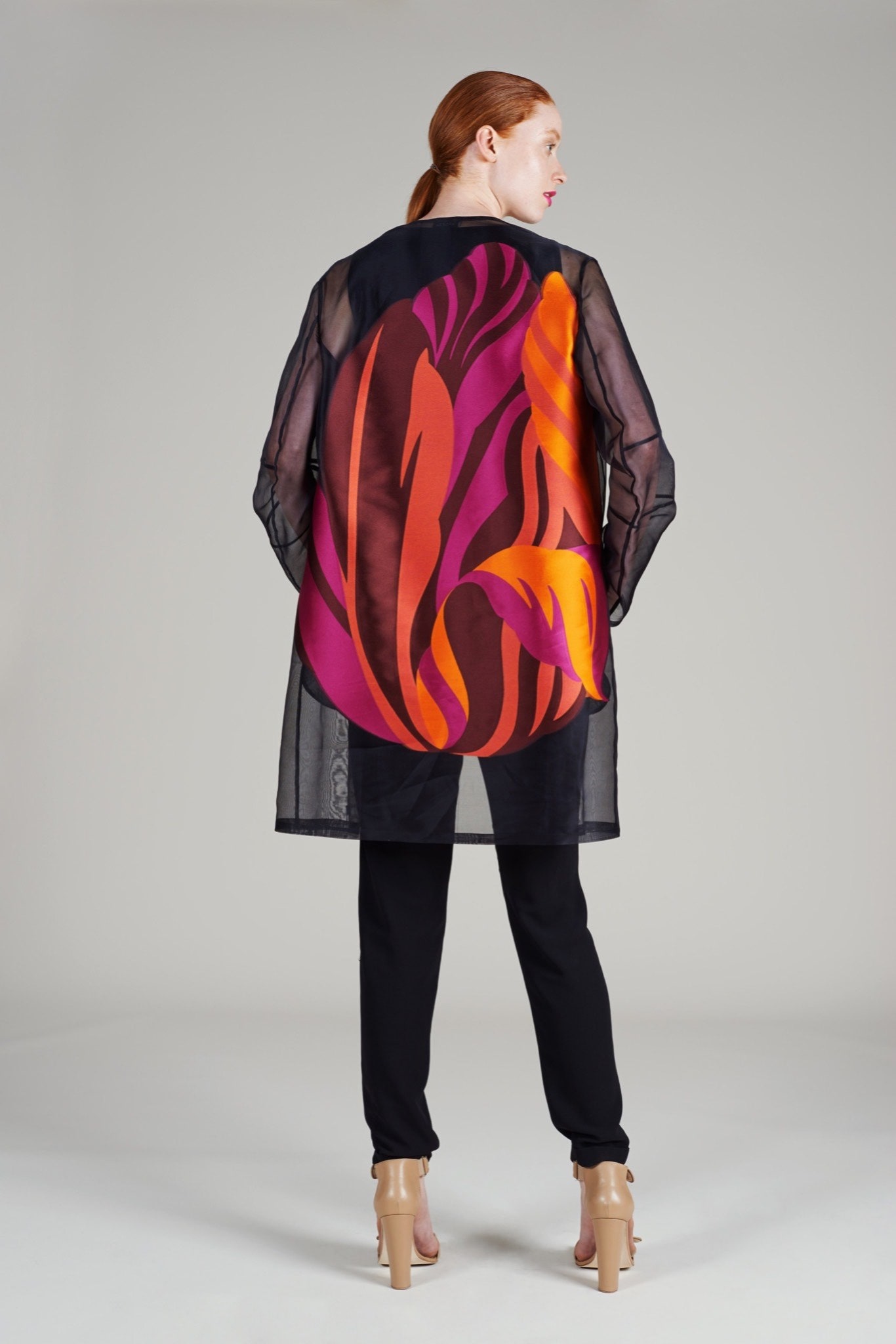 sheer printed top with black pants