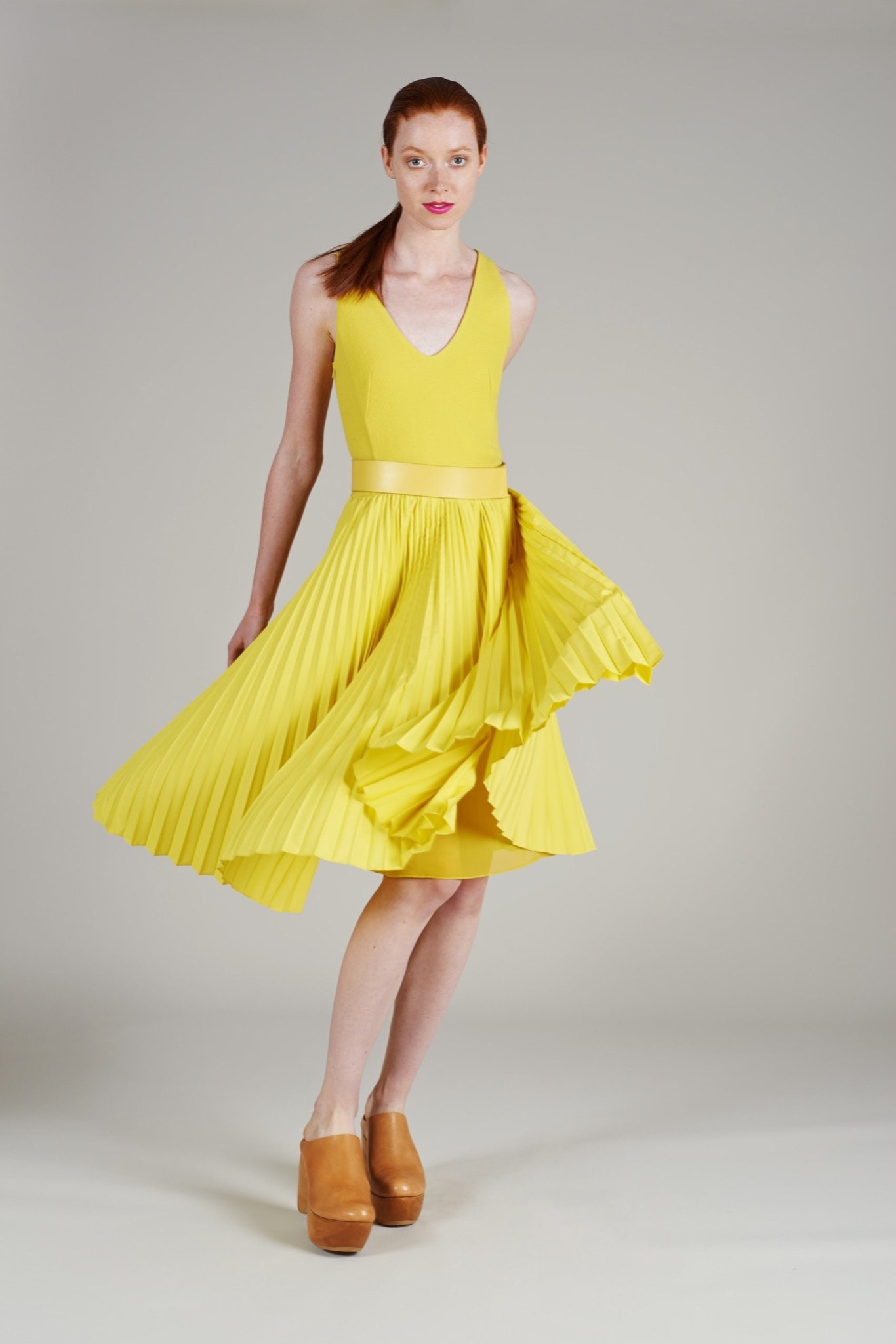 yellow pleated sleeveless dress