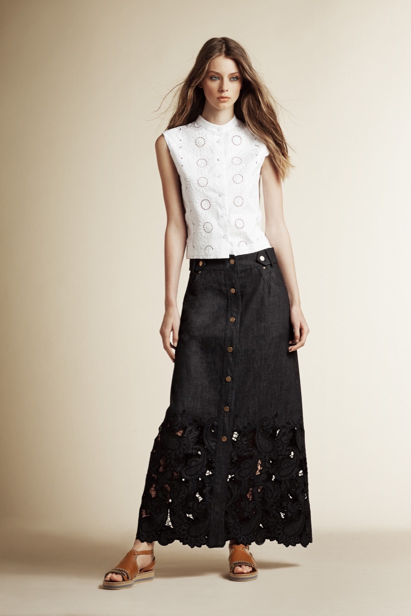 white sleeveless top and black maxi skirt