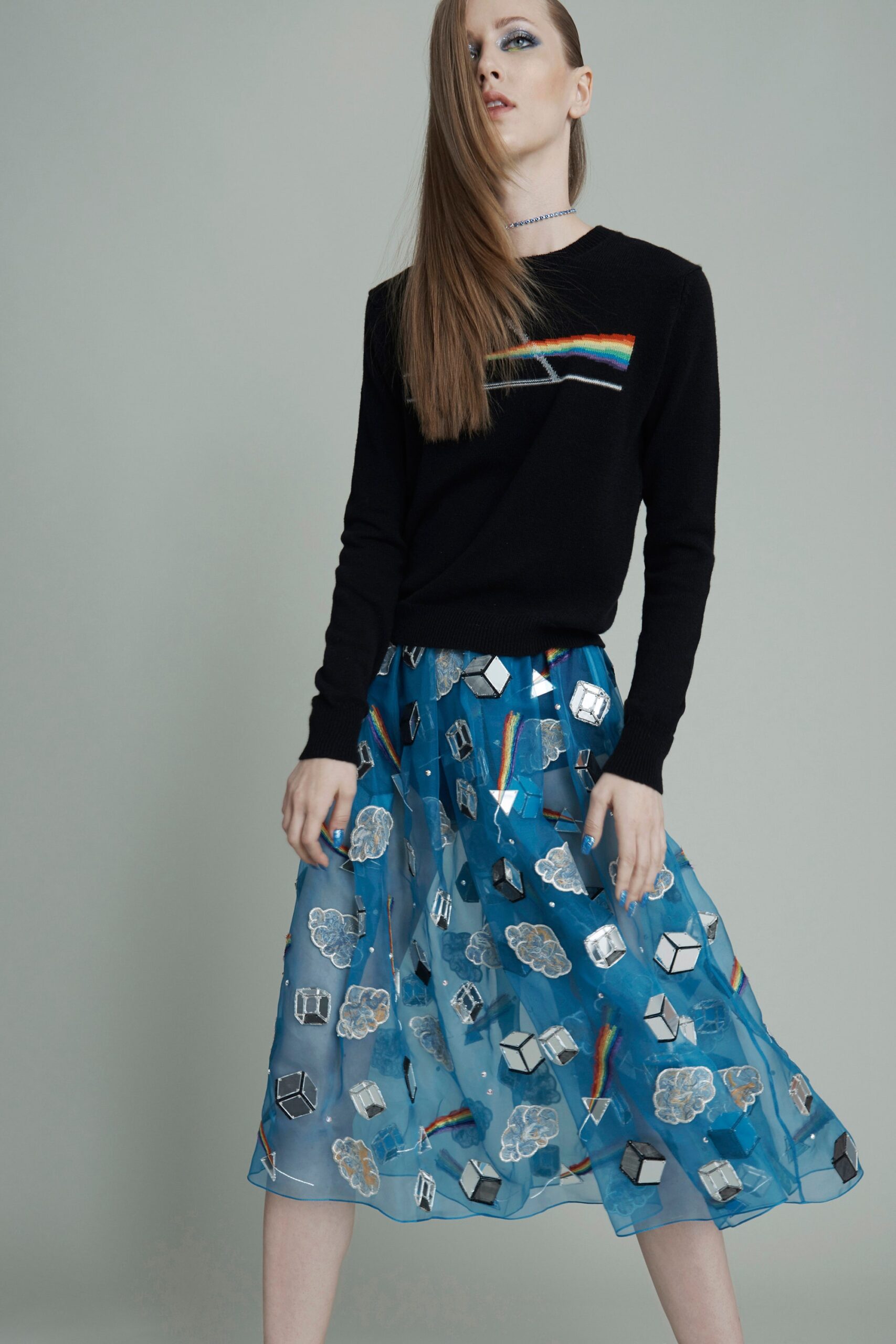 black fitted sweater with blue skirt