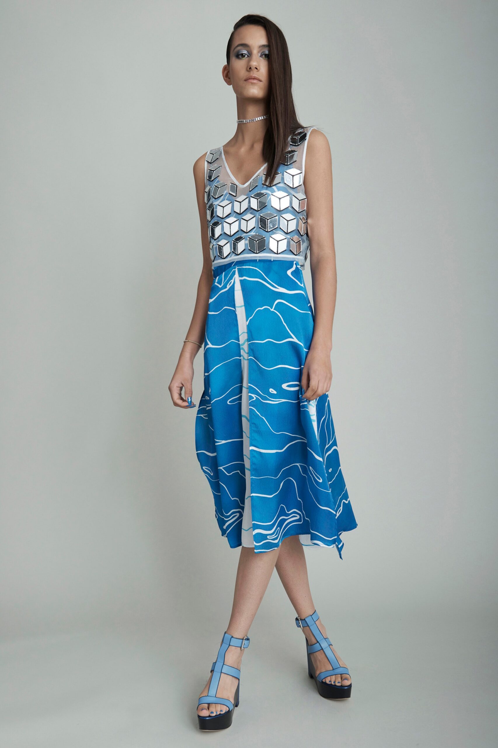 silver embellished top with blue skirt