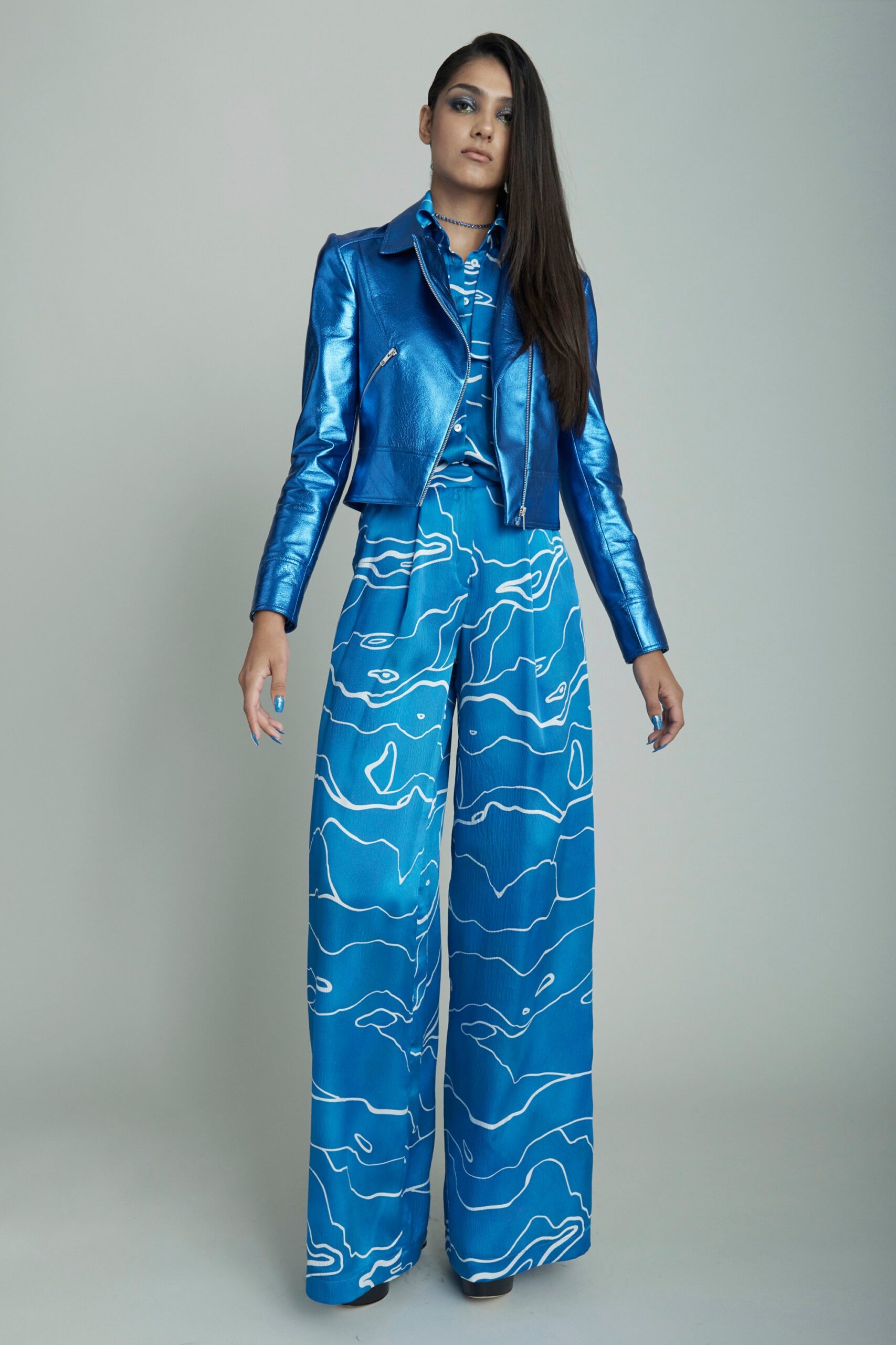 blue metallic jacket and jumpsuit